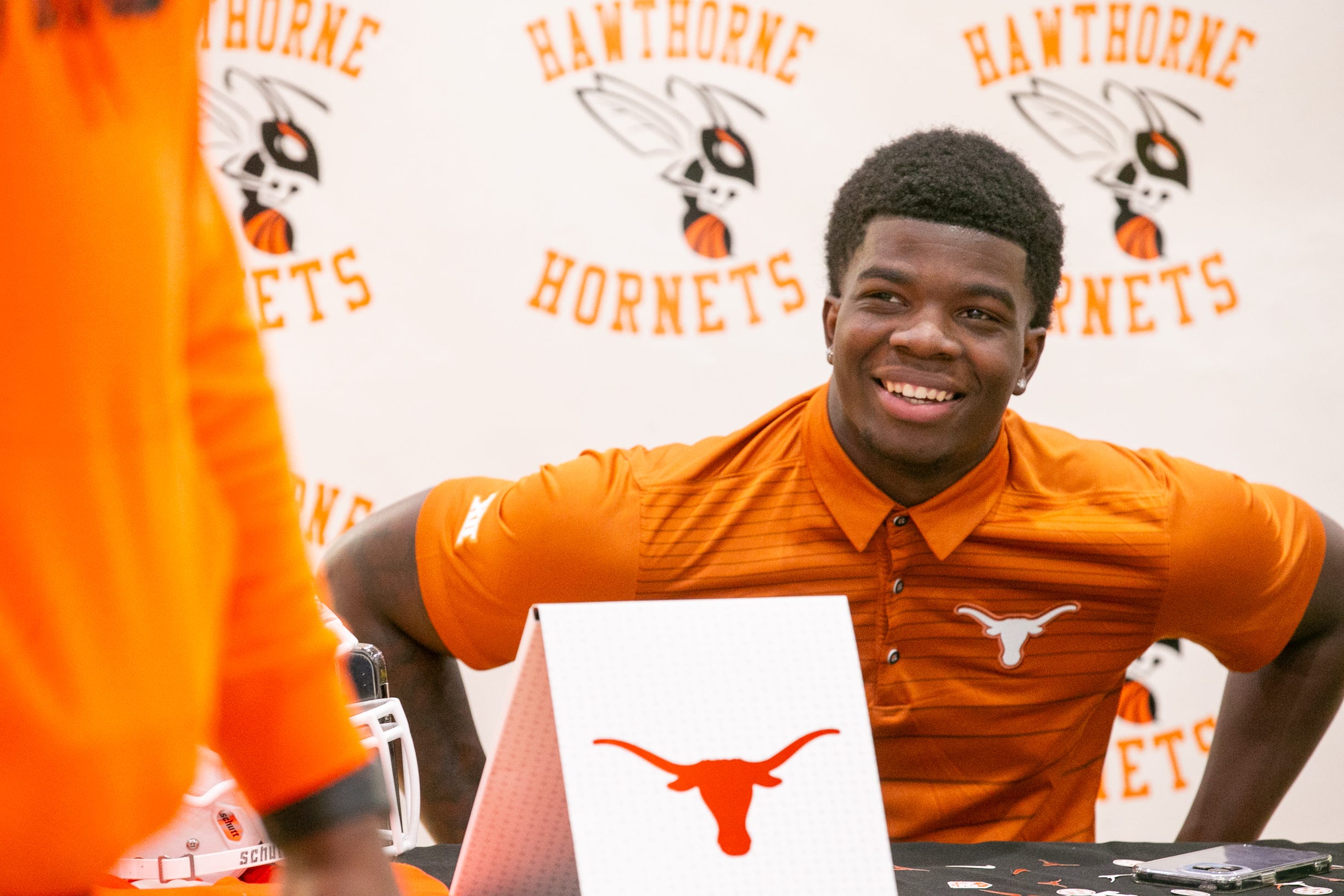 Jerrick Gibson signs his letter of intent to play football at Texas at Hawthorne Middle/High School in Hawthorne, FL on Thursday, December 21, 2023.