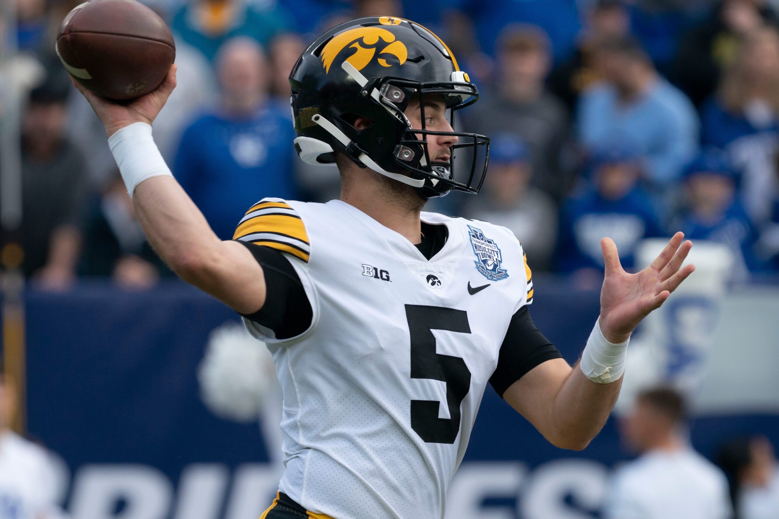 Iowa quarterback Joe Labas (5) throws pass during the first quarter of the TransPerfect Music City Bowl against Kentucky, Saturday, Dec. 31, 2022, at Nissan Stadium in Nashville, Tenn.