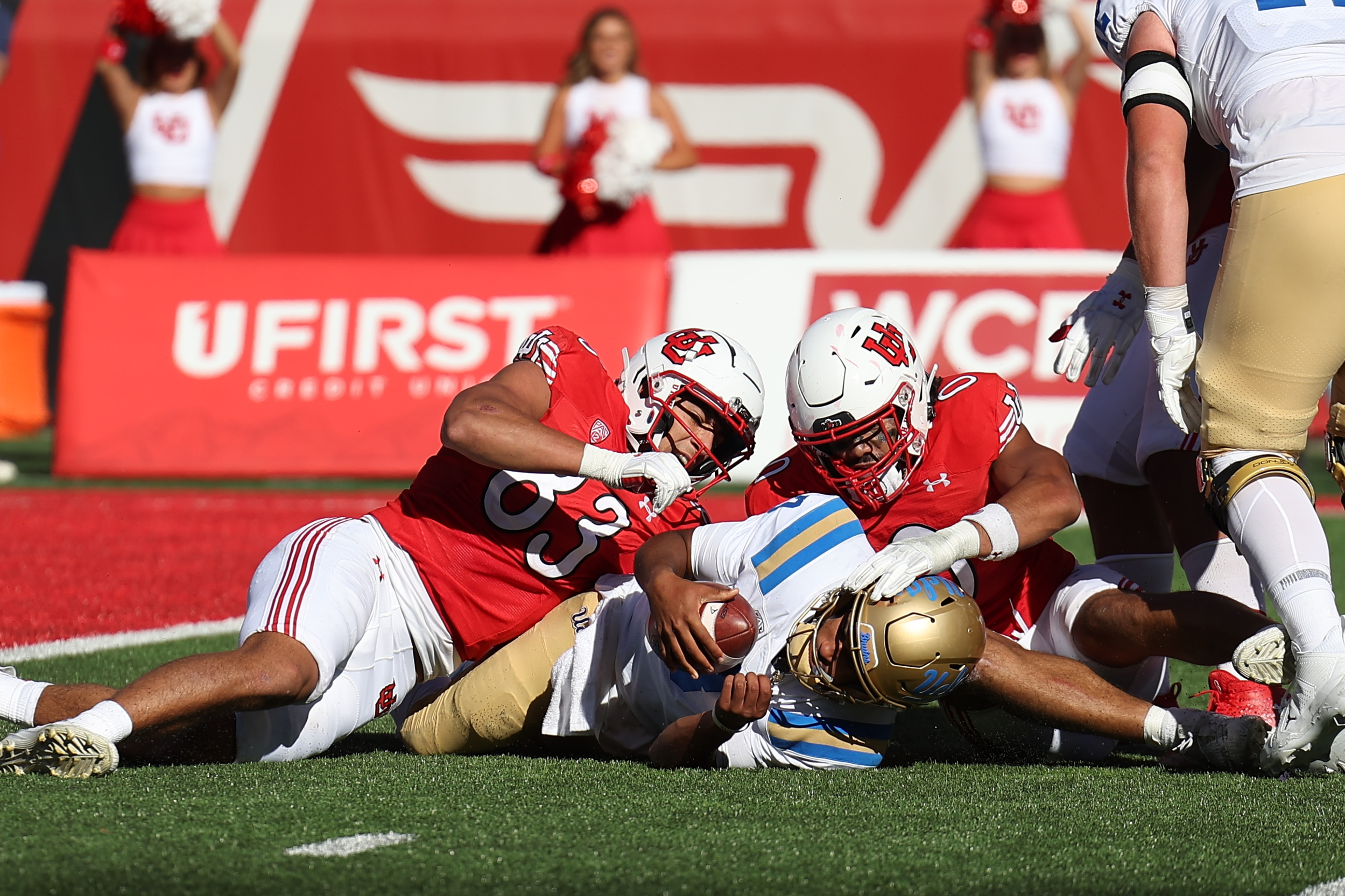 Sep 23, 2023; Salt Lake City, Utah, USA; UCLA Bruins quarterback Dante Moore (3) is sacked by Utah Utes defensive end Jonah Elliss (83) and Utah Utes defensive end Logan Fano (0) in the fourth quarter at Rice-Eccles Stadium.