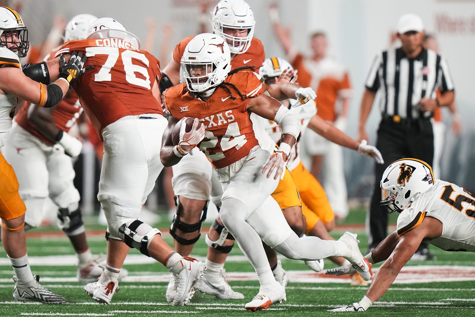 Texas Longhorns running back Jonathon Brooks (24) runs the ball forward during the Texas Longhorns' game against the Wyoming Cowboys, Saturday, Sept. 16 at Darrell K Royal Texas Memorial Stadium in Austin.