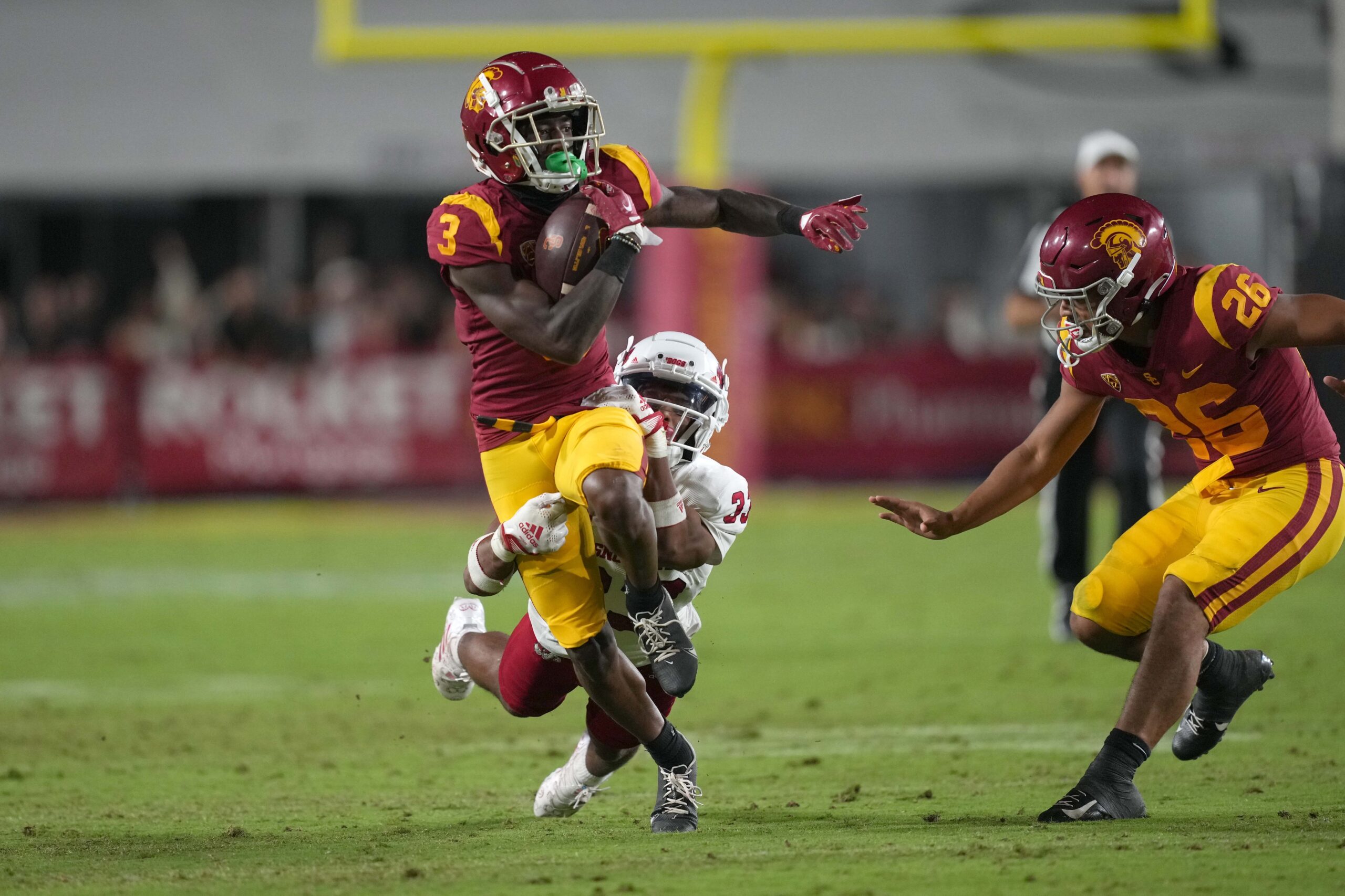 Sep 17, 2022; Los Angeles, California, USA; Southern California Trojans wide receiver Jordan Addison (3) carries the ball against the Fresno State Bulldogs in the second half at United Airlines Field at Los Angeles Memorial Coliseum.
