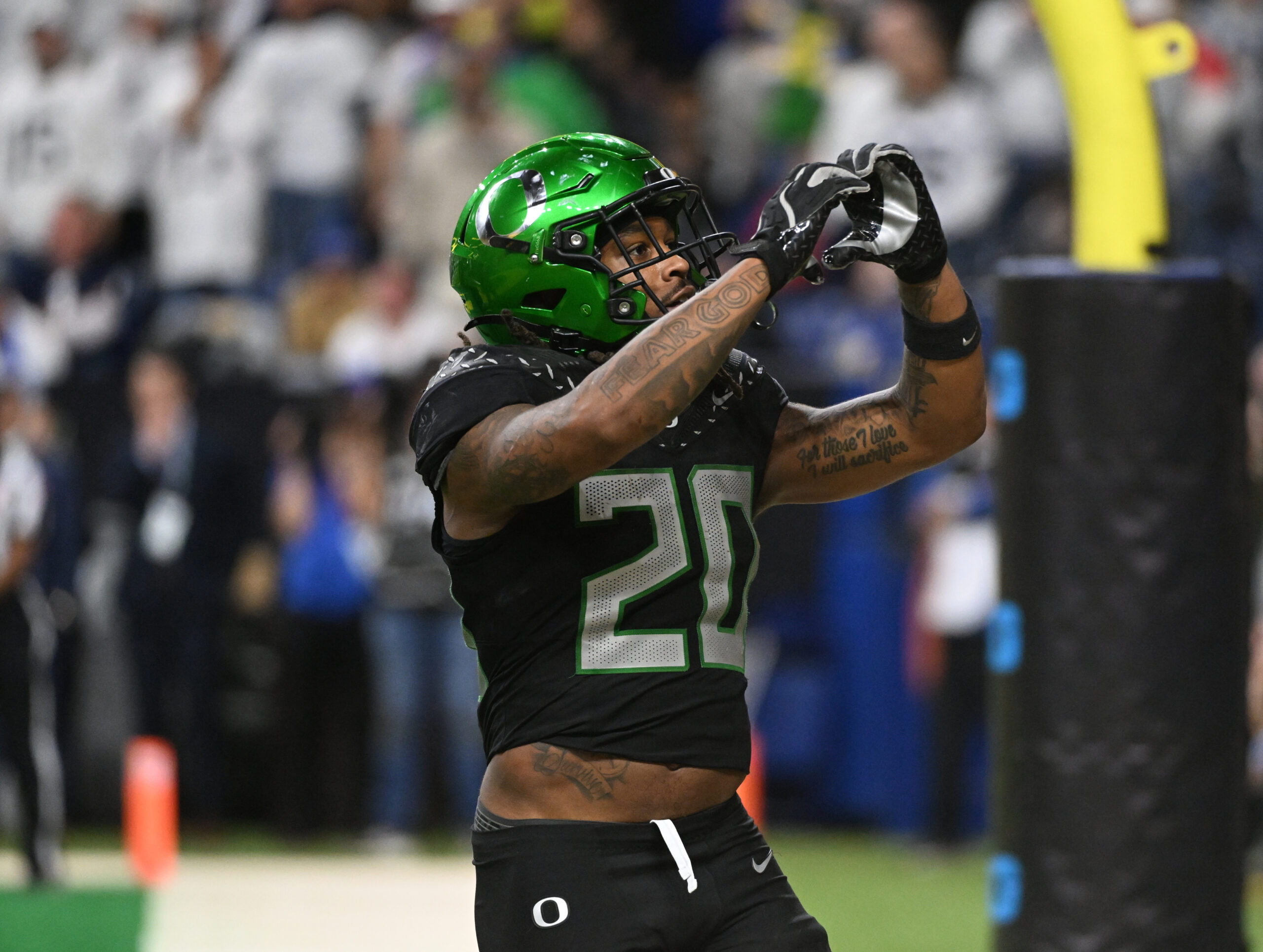 Dec 7, 2024; Indianapolis, IN, USA; Oregon Ducks running back Jordan James (20) reacts after rushing for a touchdown against the Penn State Nittany Lions during the fourth quarter in the 2024 Big Ten Championship game at Lucas Oil Stadium.