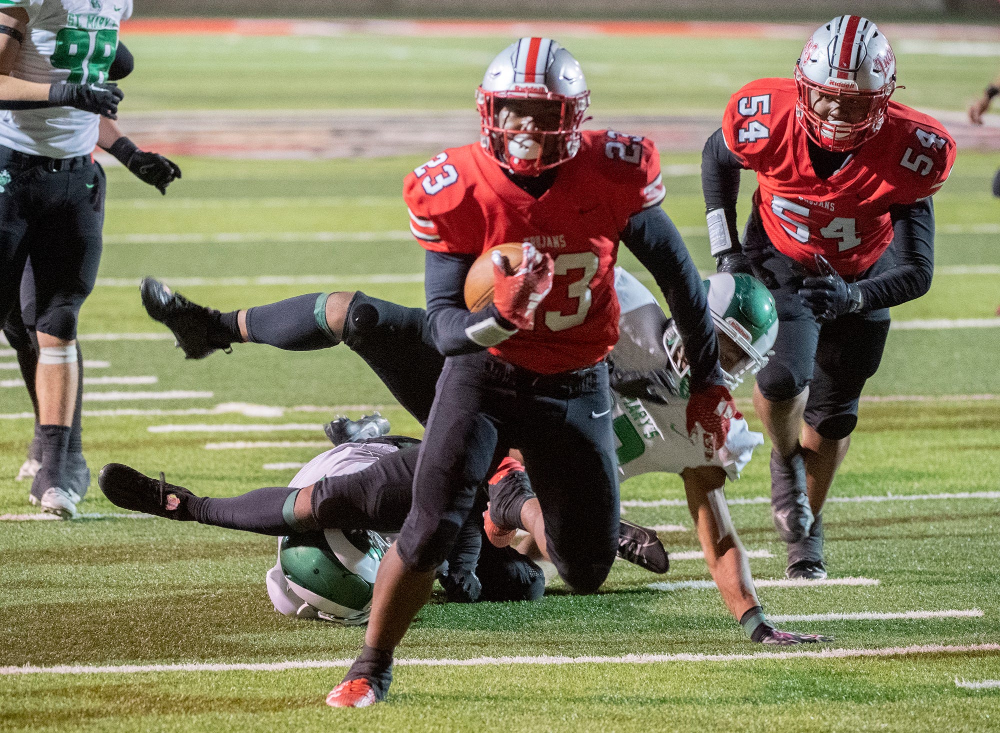 Lincoln's Jordin Thomas gets past St.Mary's defenders to score at touchdown during a varsity football game at Lincoln's Spanos Stadium in Stockton on Oct. 27, 2023.