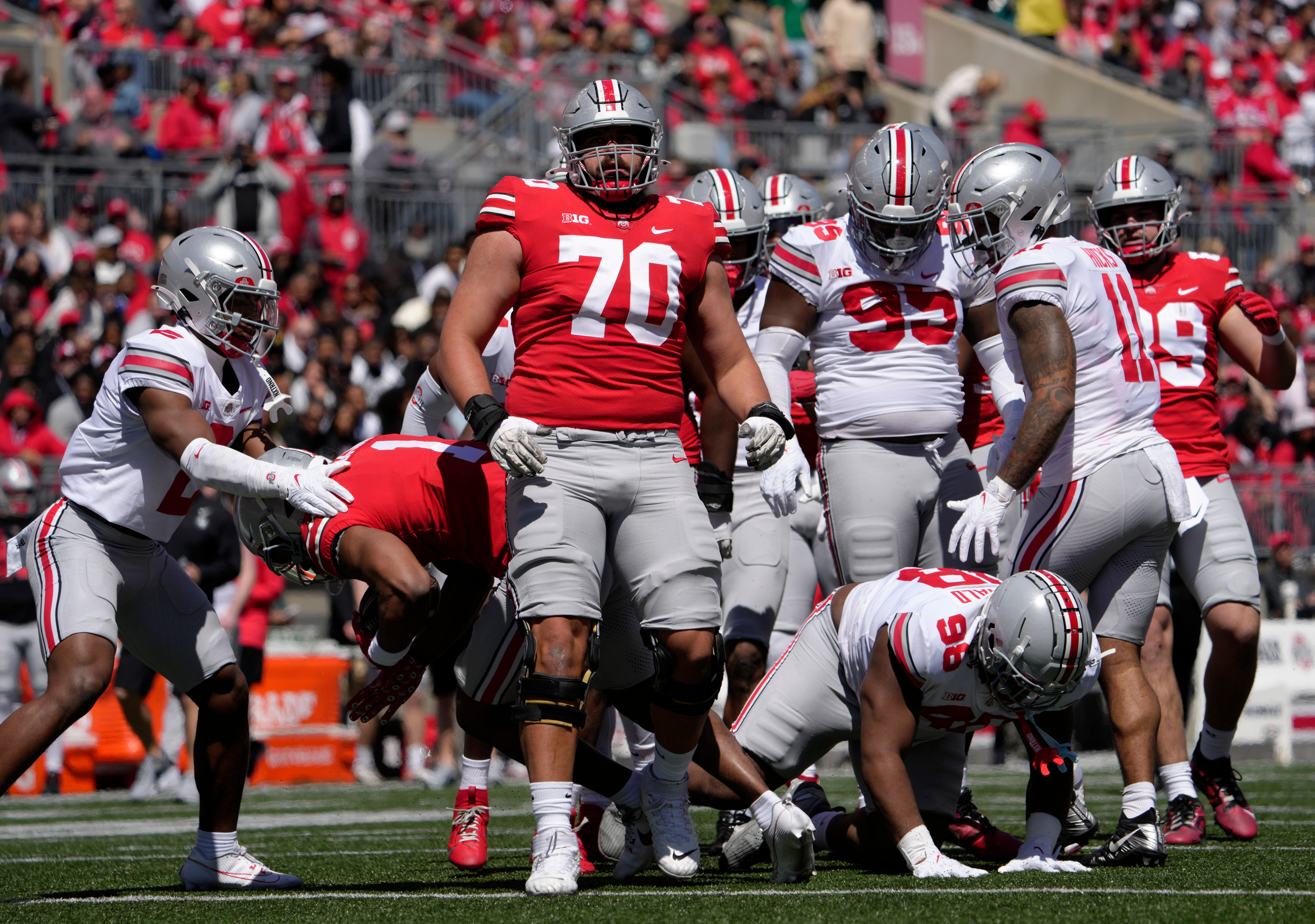 April 13, 2024; Columbus, Ohio, USA; Ohio State Buckeyes offensive lineman Josh Fryar (70) competes during the first half of the LifeSports spring football game at Ohio Stadium on Saturday.