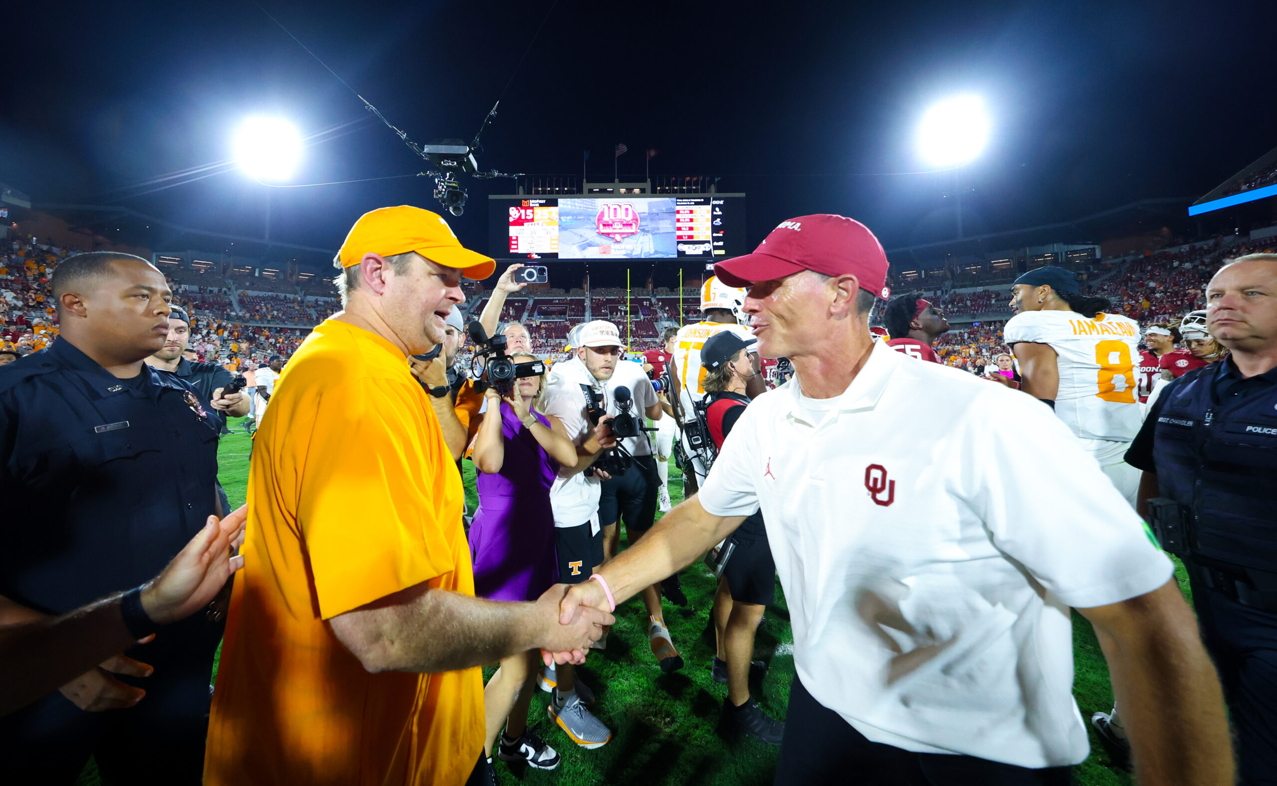 Sep 21, 2024; Norman, Oklahoma, USA; Tennessee Volunteers head coach Josh Heupel (left) shakes hands with Oklahoma Sooners head coach Brent Venables (right) after the game at Gaylord Family-Oklahoma Memorial Stadium. 