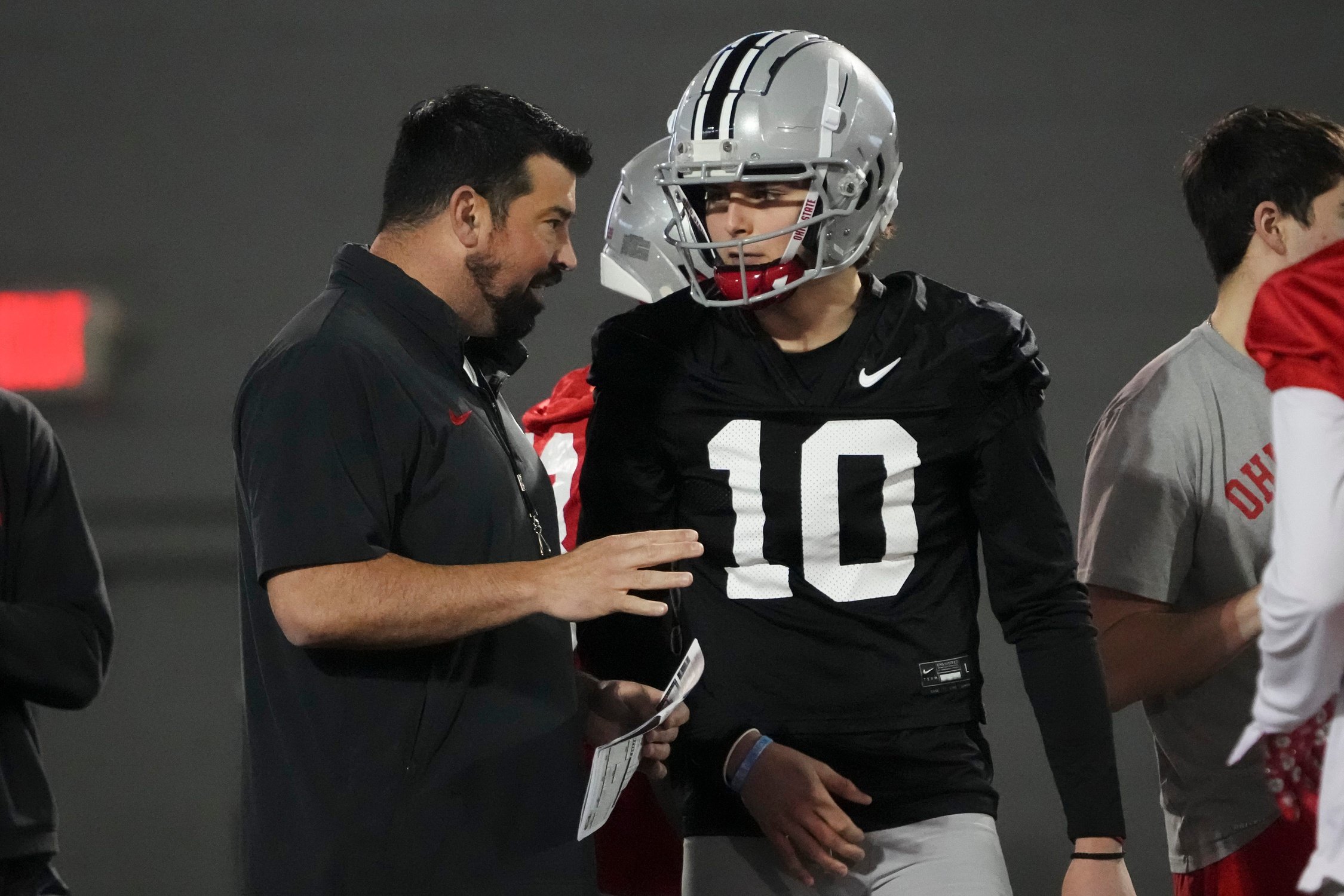 Mar 7, 2024; Columbus, OH, USA; Ohio State Buckeyes head coach Ryan Day talks to quarterback Julian Sayin (10) during spring football practice at the Woody Hayes Athletic Center.