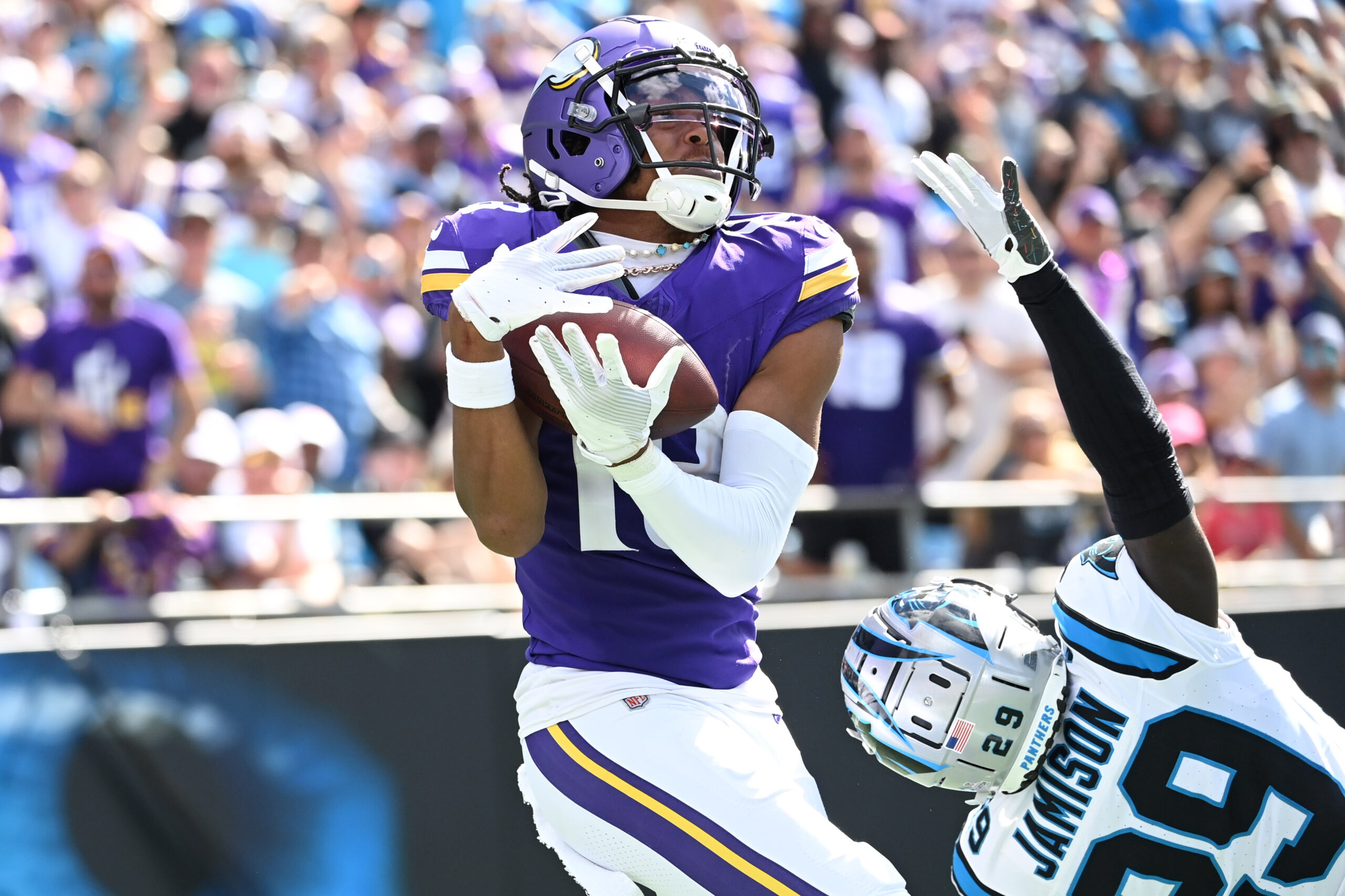 Oct 1, 2023; Charlotte, North Carolina, USA; Minnesota Vikings wide receiver Justin Jefferson (18) catches a touchdown pass as Carolina Panthers cornerback D'Shawn Jamison (29) defends in the third quarter at Bank of America Stadium.