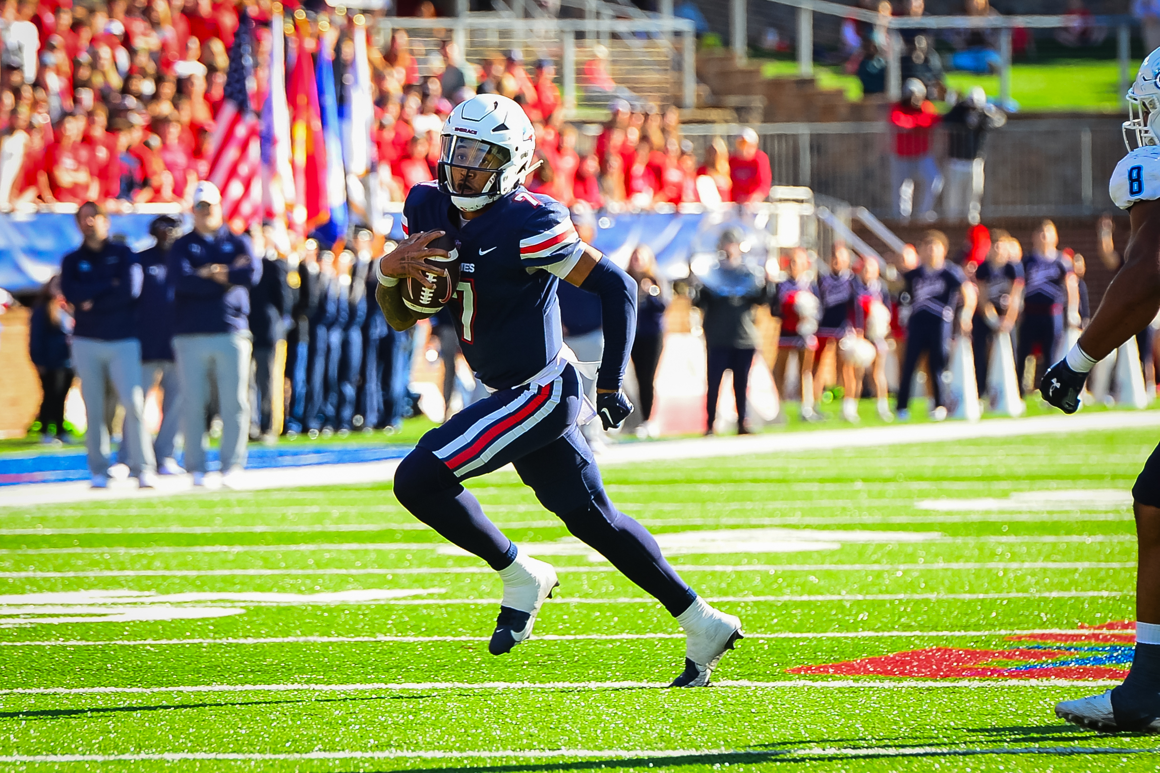 Nov 11, 2023; Lynchburg, Virginia, USA; Liberty Flames quarterback Kaidon Salter (7) is tackled by Old Dominion Monarchs linebacker Wayne Matthews III (15) and Old Dominion Monarchs linebacker Jason Henderson (42) at Williams Stadium.