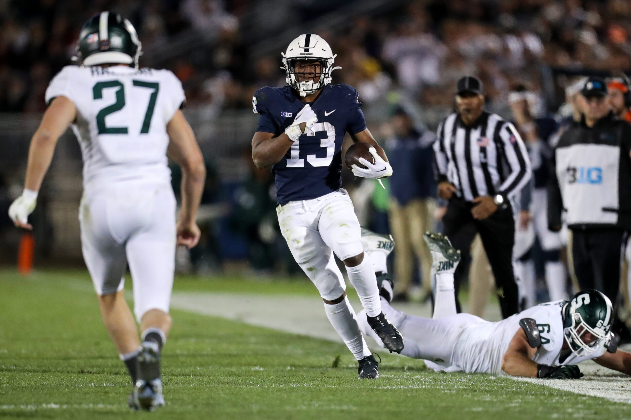 Oct 5, 2024; University Park, Pennsylvania, USA; Penn State Nittany Lions running back Kaytron Allen (13) runs with the ball during the fourth quarter against the UCLA Bruins at Beaver Stadium.