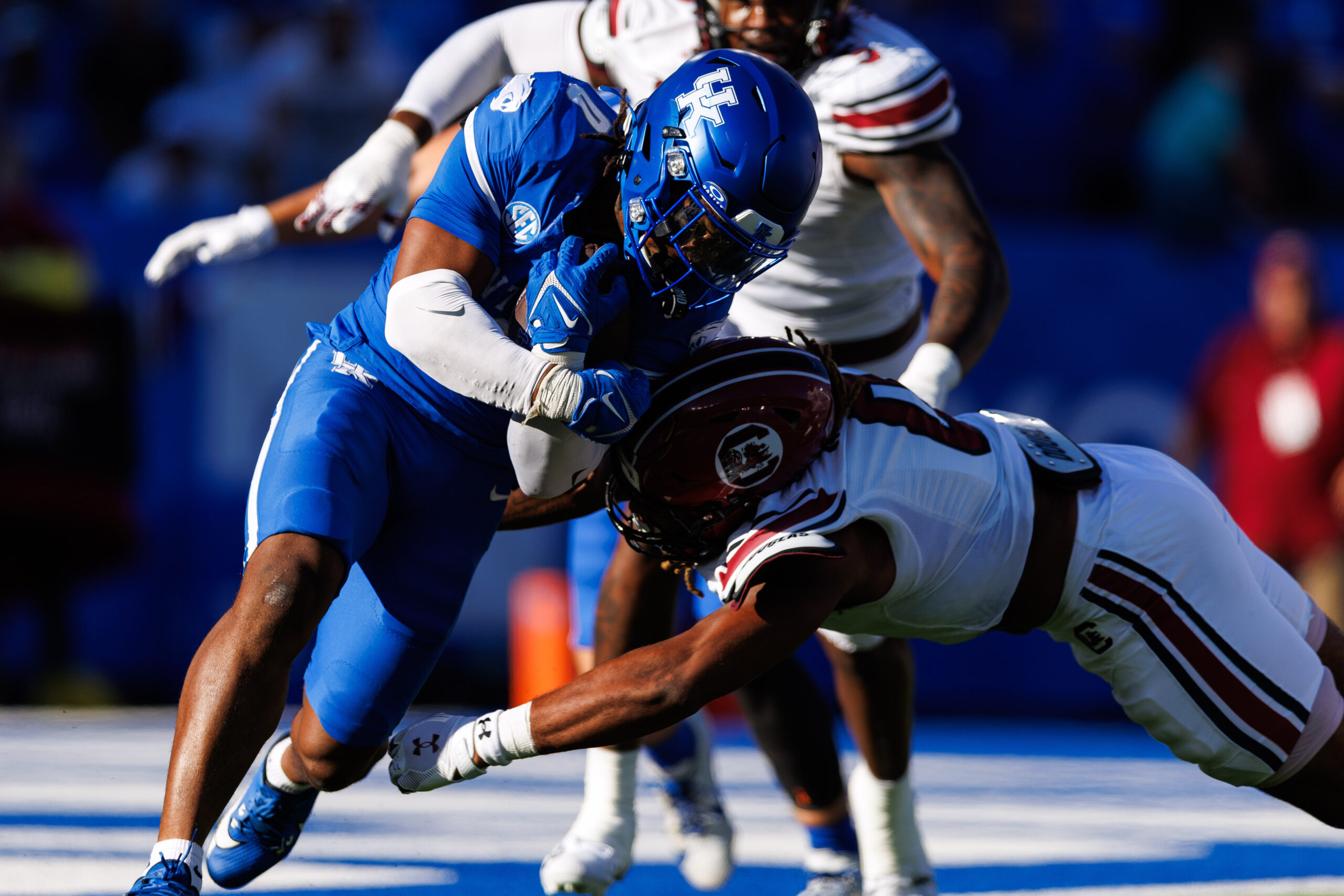 Sep 7, 2024; Lexington, Kentucky, USA; Kentucky Wildcats running back Demie Sumo-Karngbaye (0) is tackled by South Carolina Gamecocks running back Juju McDowell (0) during the third quarter at Kroger Field. 