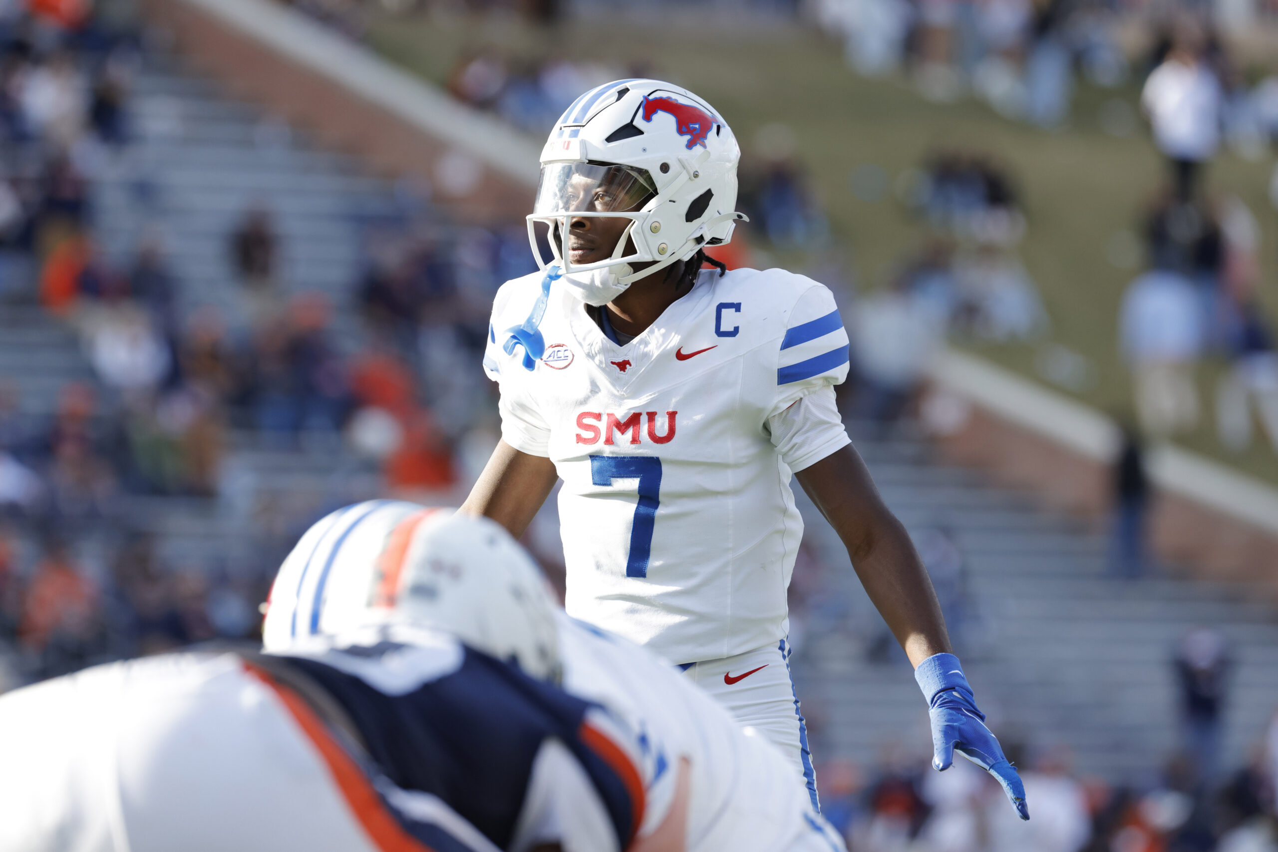 Nov 23, 2024; Charlottesville, Virginia, USA; Southern Methodist Mustangs quarterback Kevin Jennings (7) looks on from the field against the Virginia Cavaliers during the second half at Scott Stadium.