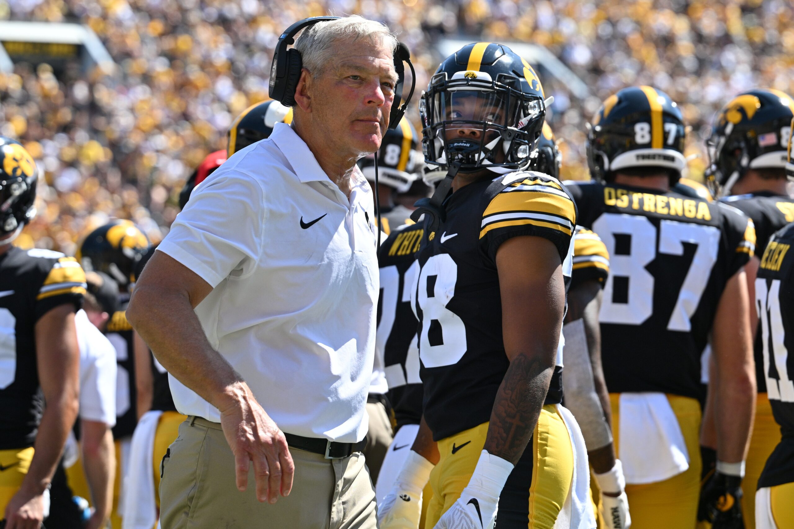 Sep 2, 2023; Iowa City, Iowa, USA; Iowa Hawkeyes head coach Kirk Ferentz and running back Kamari Moulton (28) look on during a timeout during the second quarter against the Utah State Aggies Kinnick Stadium.
