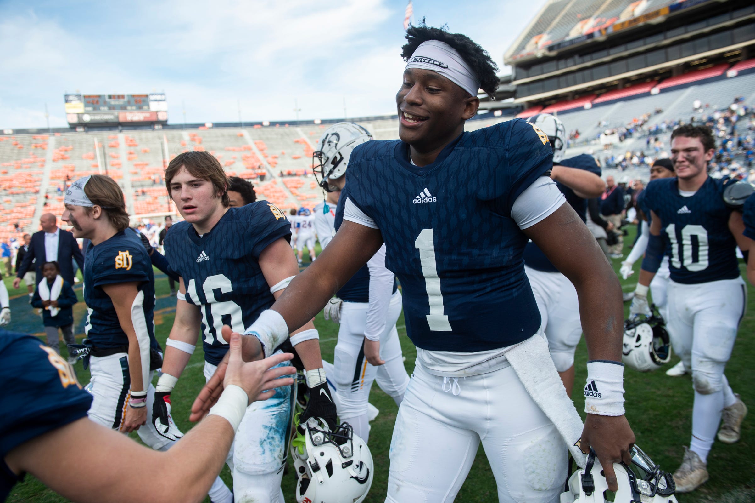 St. James' KJ Jackson (1) celebrates with his team during the AHSAA Super 7 football Class 3A state championship at Jordan-Hare Stadium in Auburn, Ala., on Thursday, Dec. 1, 2022. St. James defeated Piedmont 45-28.