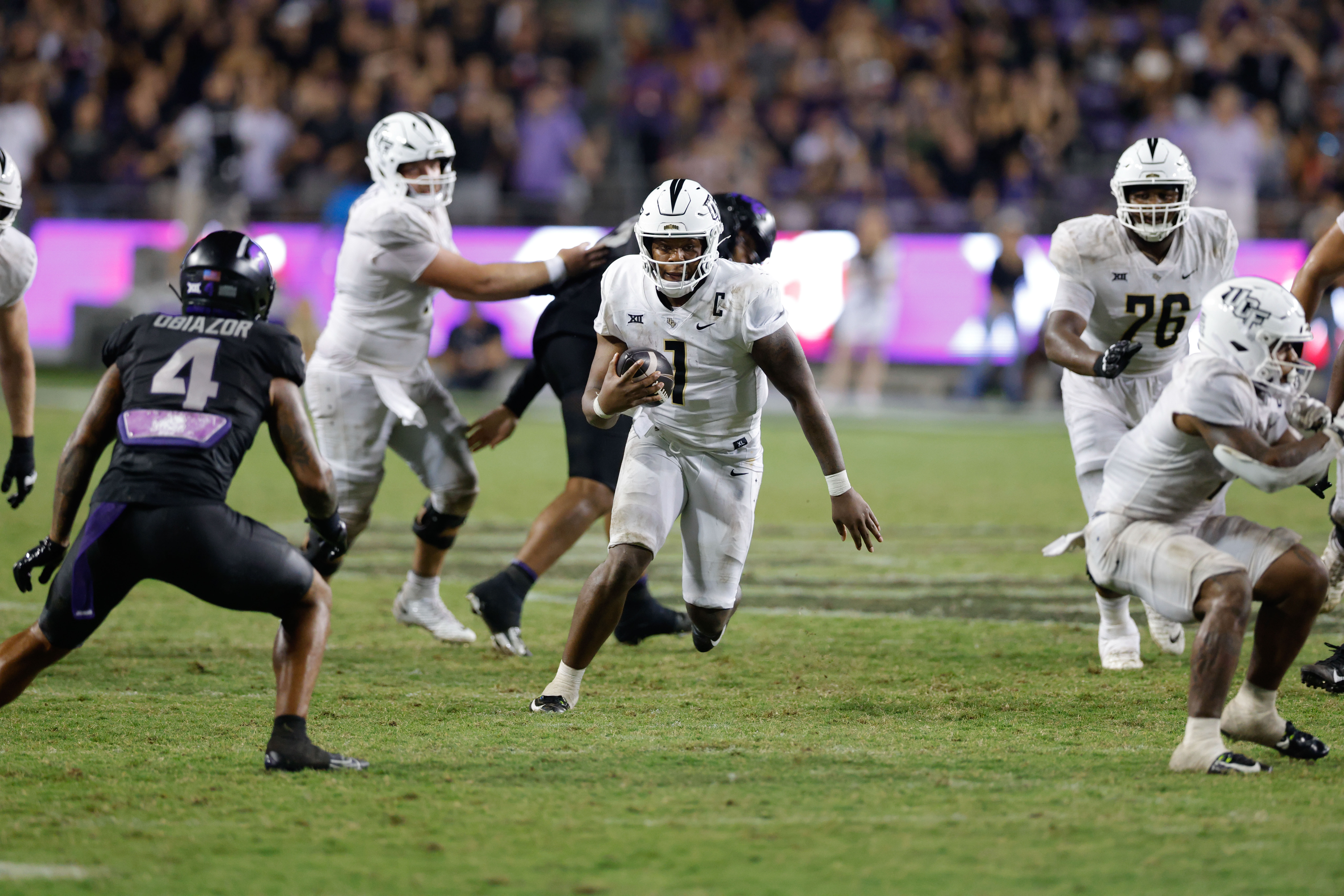 Sep 24, 2022; Arlington, Texas, USA; Arkansas Razorbacks quarterback KJ Jefferson (1) breaks through the line during the fourth quarter against the Texas A&M Aggies at AT&T Stadium.