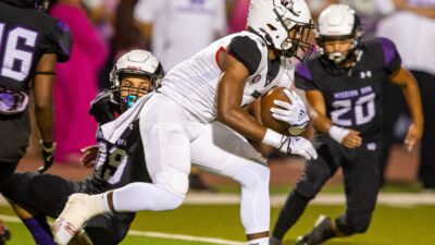 Mission Oak's Achilles Sierra tries to tackle Hanford's Kourdey Glass during a West Yosemite League high school football game between Hanford and Mission Oak Friday