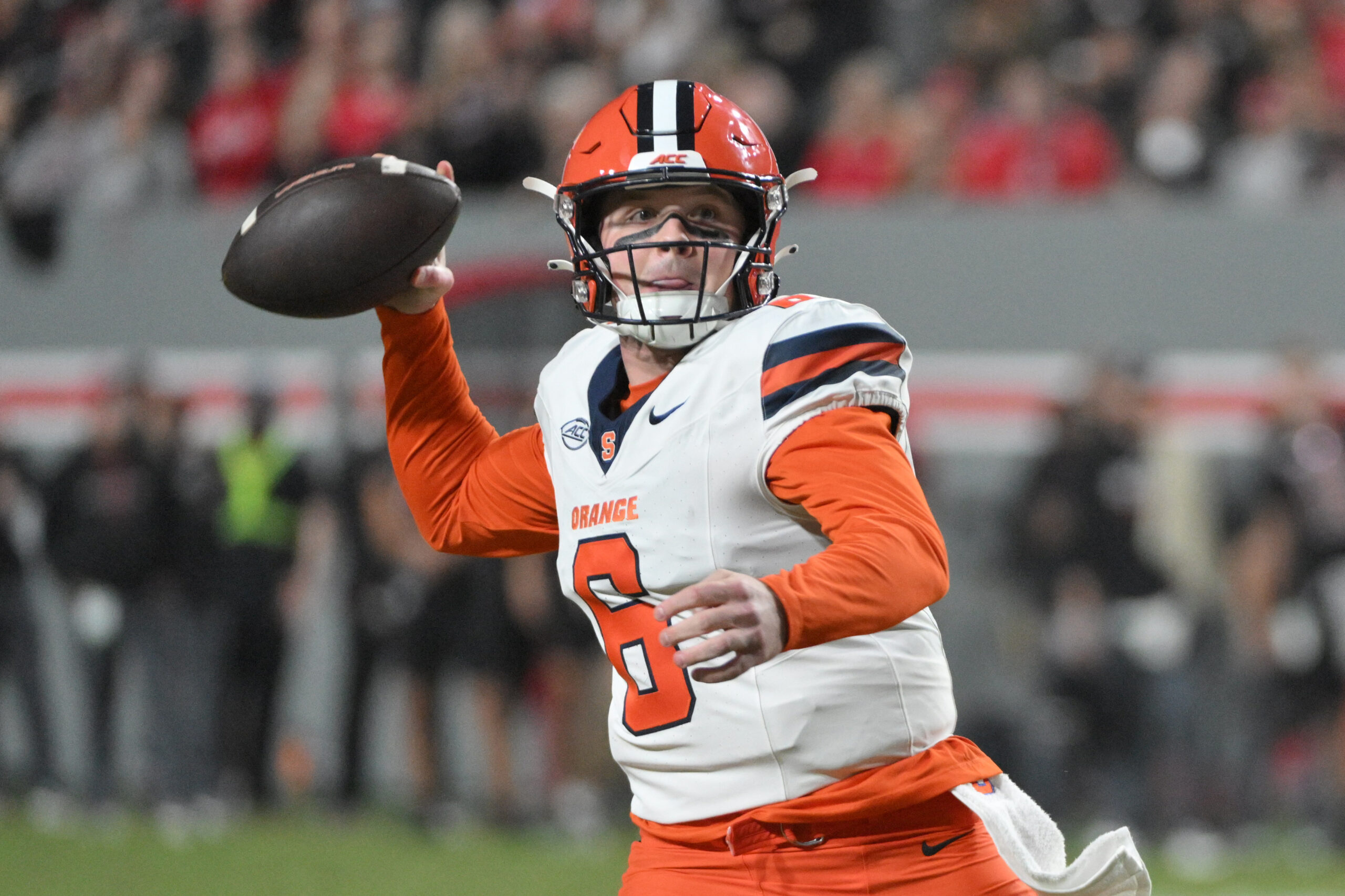 Syracuse Orange quarter back Kyle McCord (6) winds up for a pass at Carter-Finley Stadium during the first half.