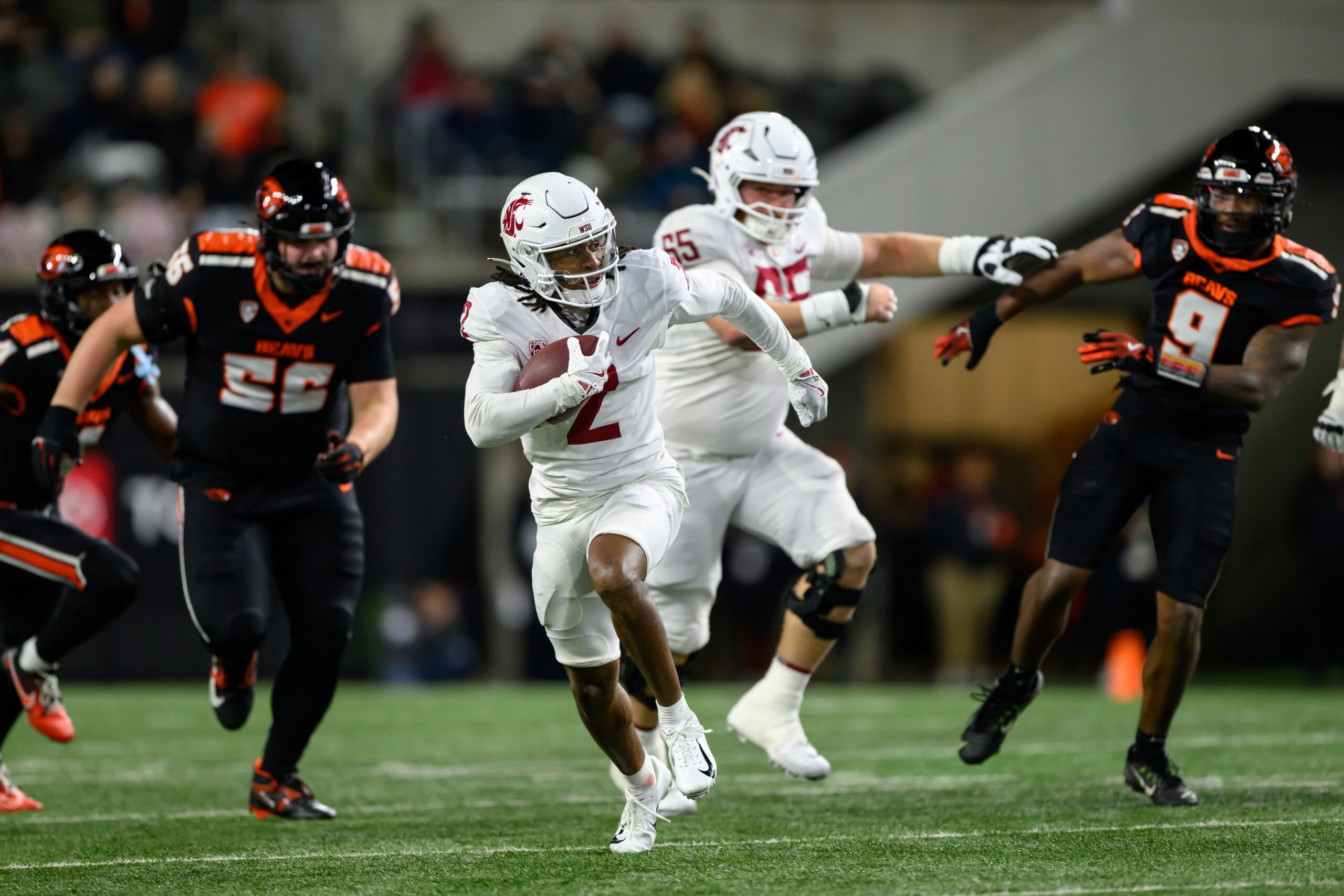 Nov 23, 2024; Corvallis, Oregon, USA; Washington State Cougars wide receiver Kyle Williams (2) runs the ball for a touchdown during the third quarter against the Oregon State Beavers at Reser Stadium.
