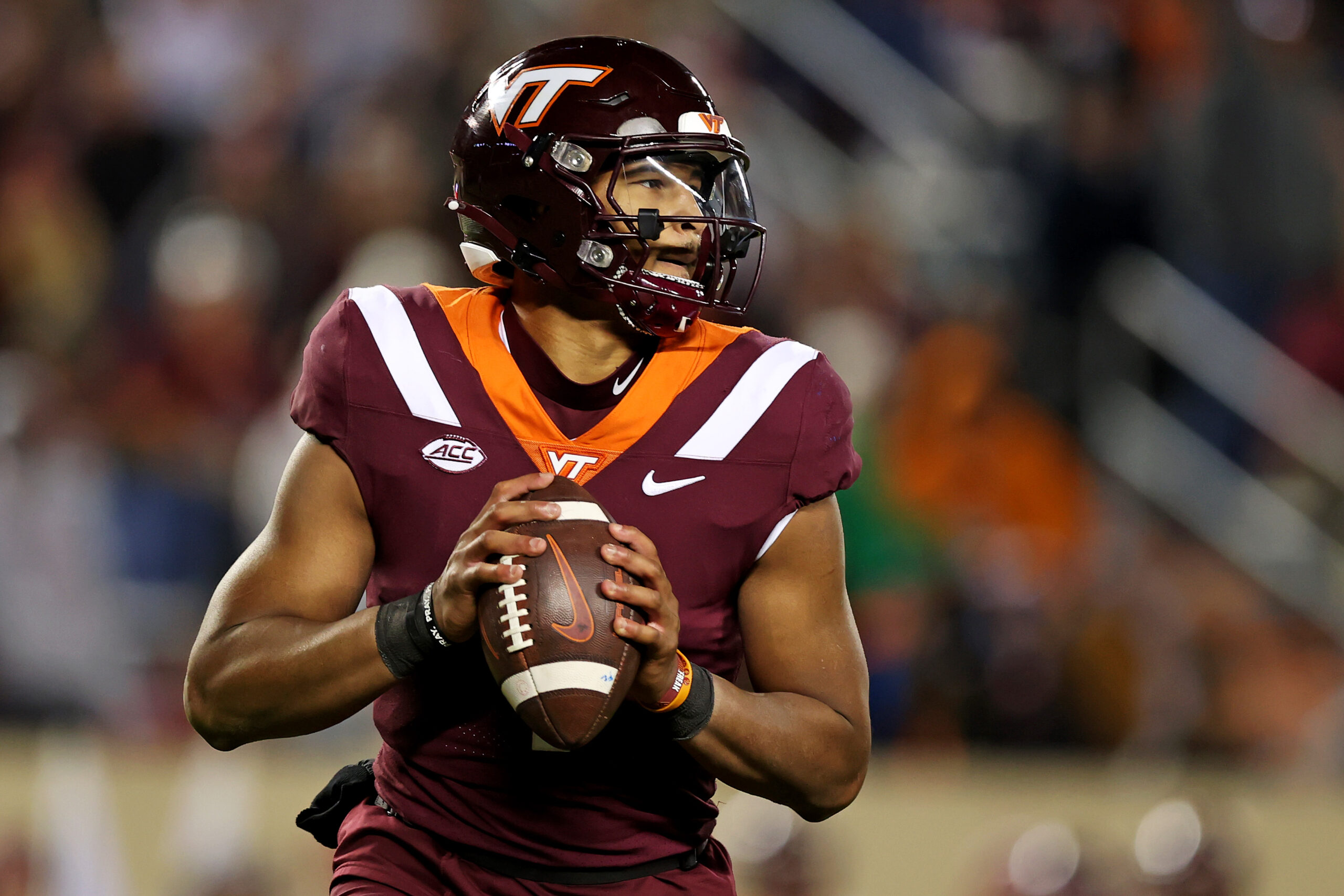 Nov 18, 2023; Blacksburg, Virginia, USA; Virginia Tech Hokies quarterback Kyron Drones (1) throws a pass against the North Carolina State Wolfpack at Lane Stadium.
