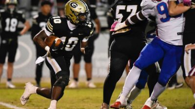 Greer's LaDainnian Martin (10) runs the ball during a game that resulted in a 42-21 win against Riverside at Dooley Field on Friday