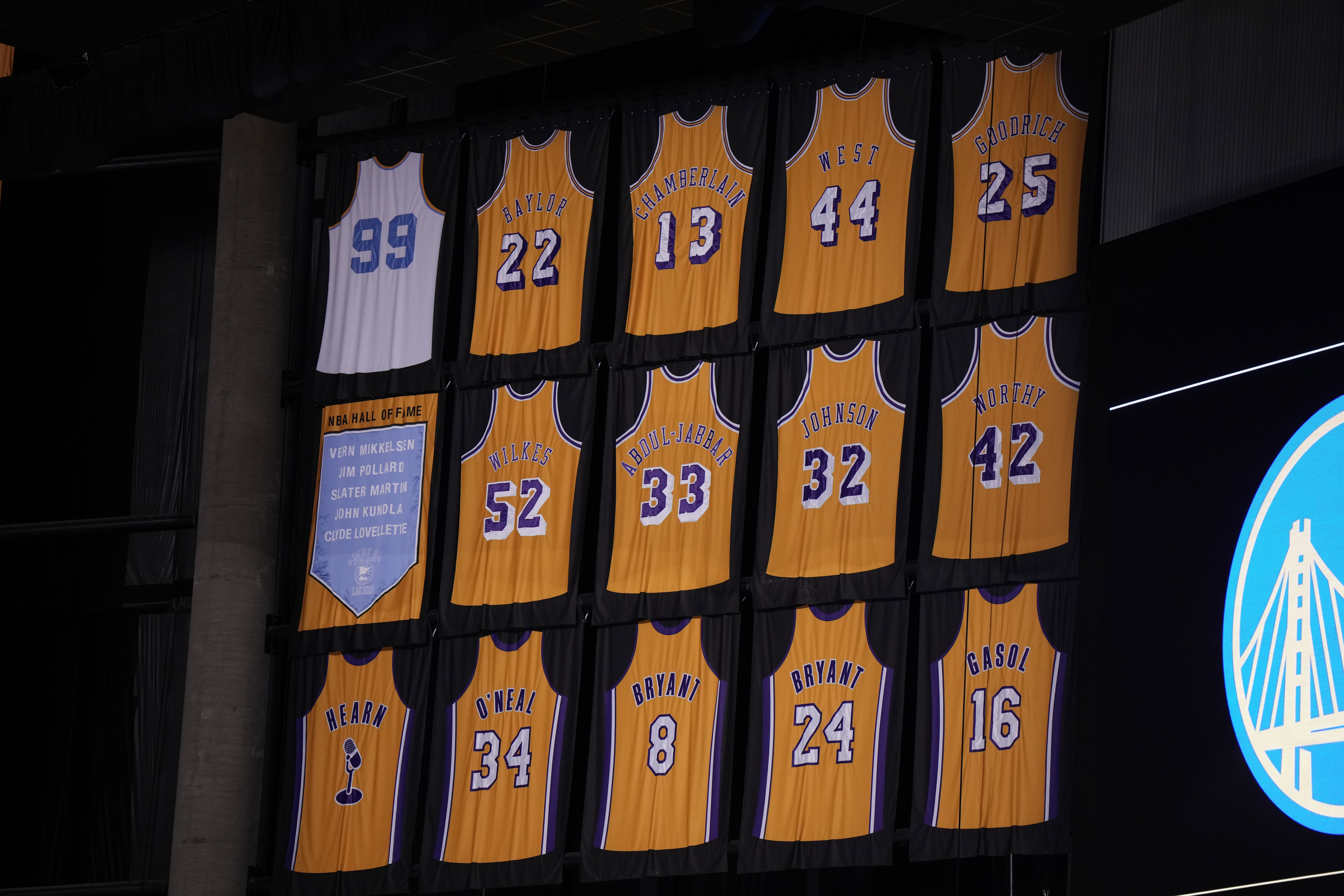 May 8, 2023; Los Angeles, California, USA; The Los Angeles Lakers retired jereys of Kareem Abdul-Jabbar (33), Elgin Baylor (22), Kobe Bryant (8 and 24), Pau Gasol (16), Gail Goodrich (25), Magic Johnson (32), Shaquille O'Neal (34), jerry West (44), Jamaal Wilkes (52), James Worthy (42), George Mikan (99) and Chick Hearn during game four of the 2023 NBA playoffs at Crypto.com Arena.