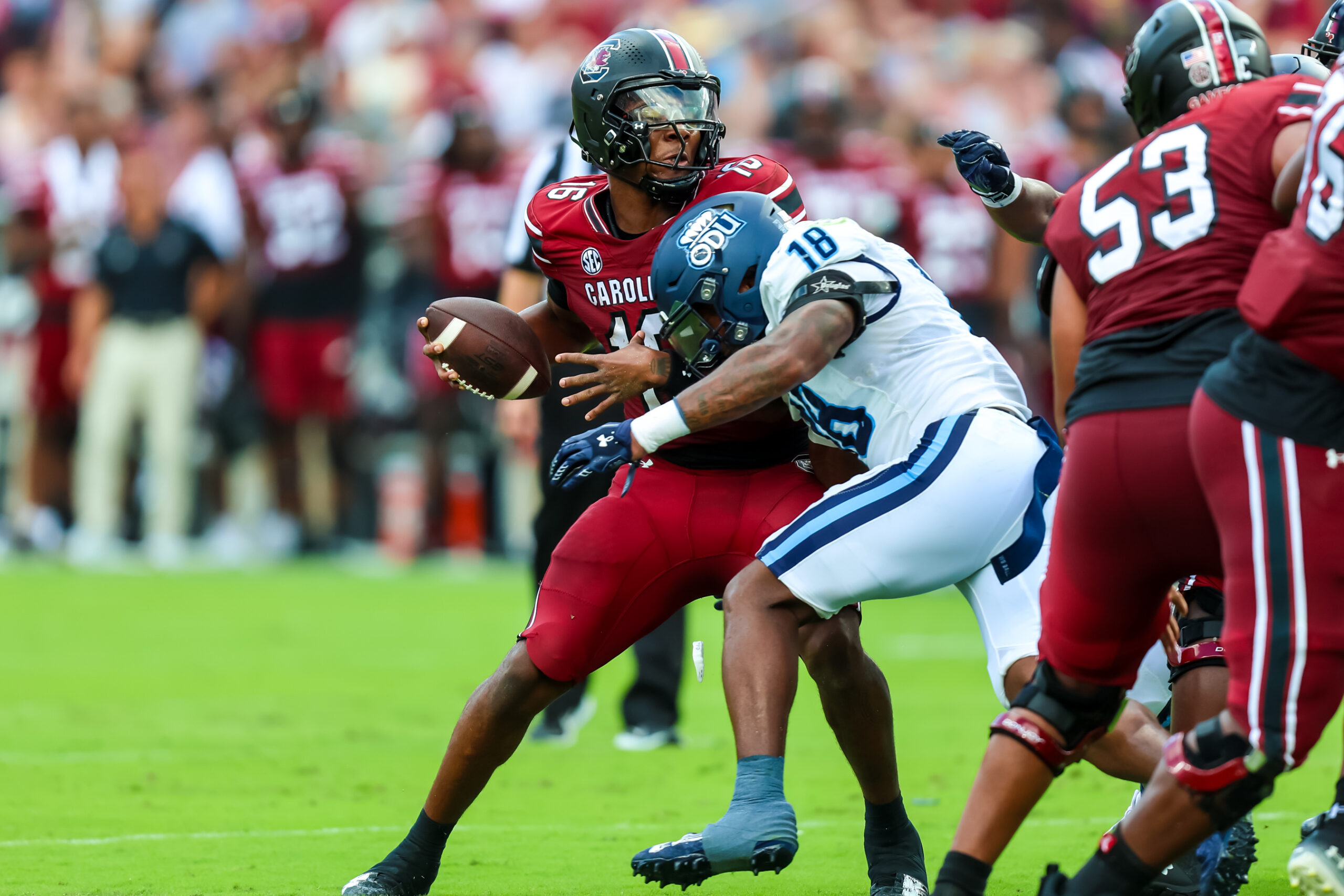 Aug 31, 2024; Columbia, South Carolina, USA; South Carolina Gamecocks quarterback LaNorris Sellers (16) is sacked by Old Dominion Monarchs linebacker Mario Thompson (18) in the first quarter at Williams-Brice Stadium. 