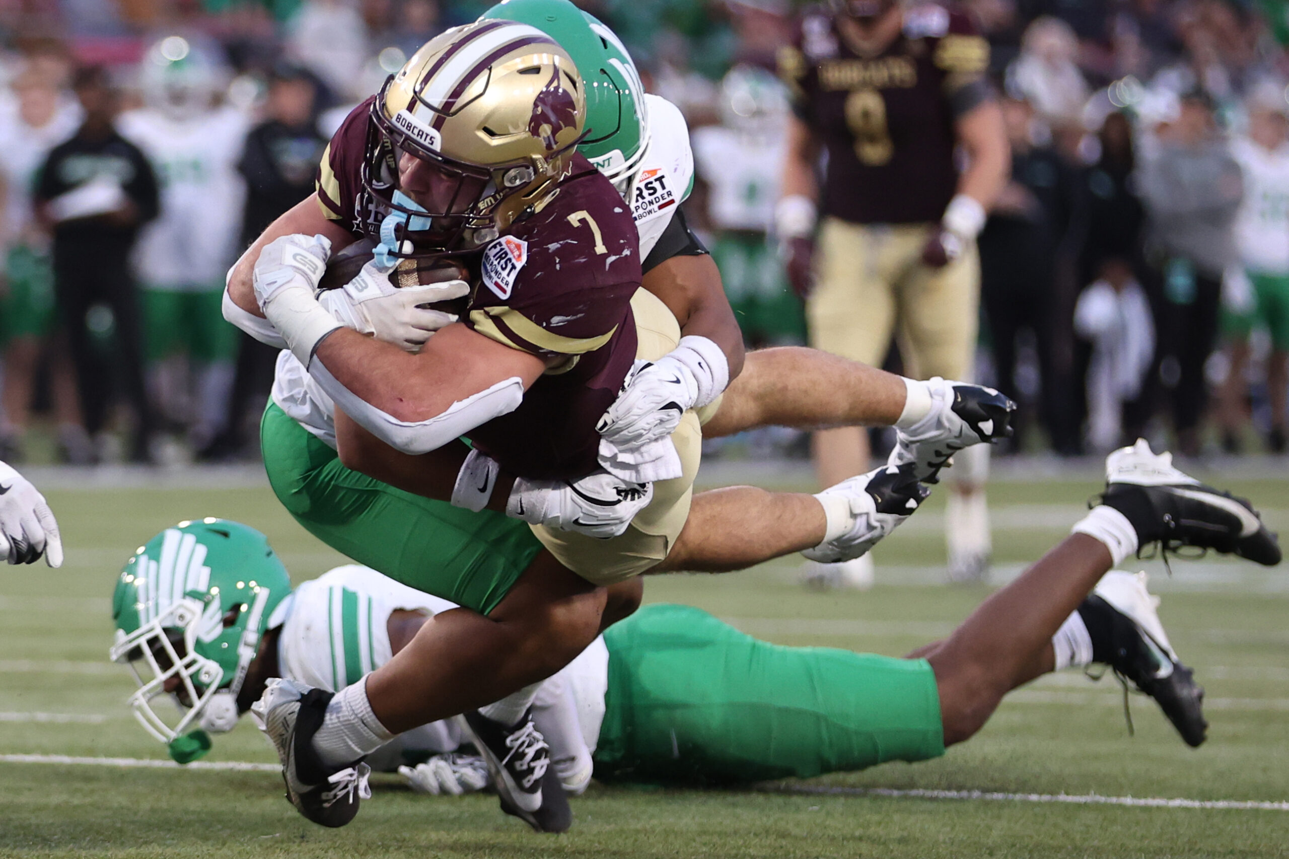 Jan 3, 2025; Dallas, TX, USA; Texas State Bobcats running back Lincoln Pare (7) dives into the end zone for a touchdown against the North Texas Mean Green during the third quarter at Gerald J. Ford Stadium. 