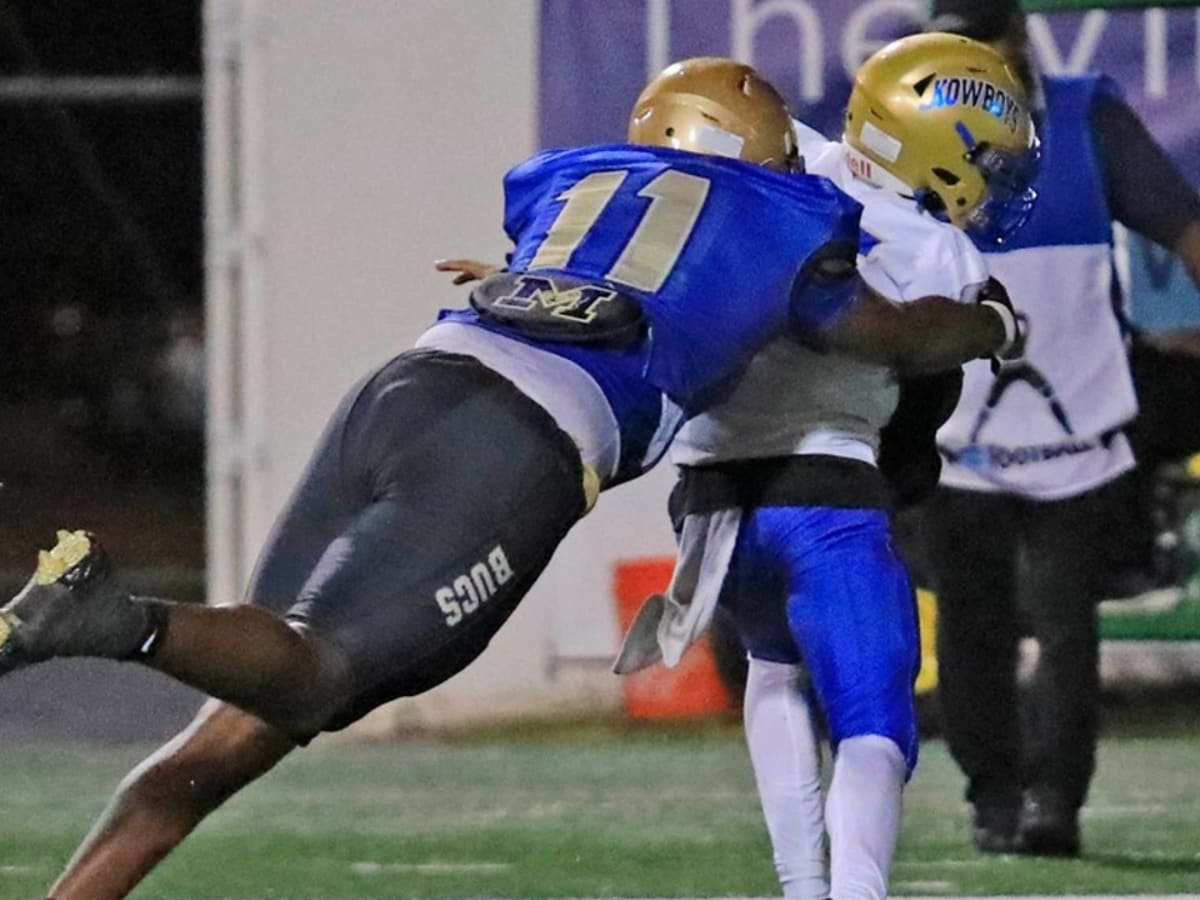 Mainland's LJ McCray (11) makes a tackle during Thursday night's game against Osceola on Oct.19th, 2023 at the Daytona Stadium.