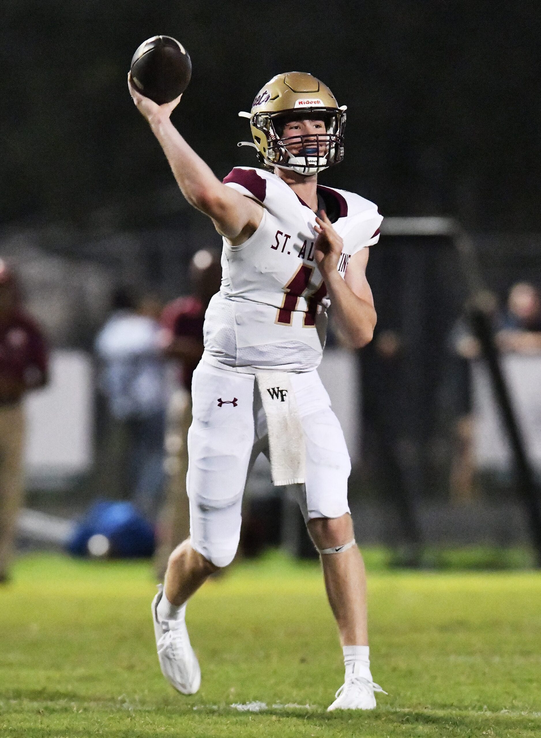 St. Augustine's quarterback Locklan Hewlett (11) targets a receiver during first-quarter action. The St. Augustine Yellow Jackets traveled to Nease High School's Panther Stadium for Friday night's Saint Johns County high school football rivalry game on October 6, 2023.