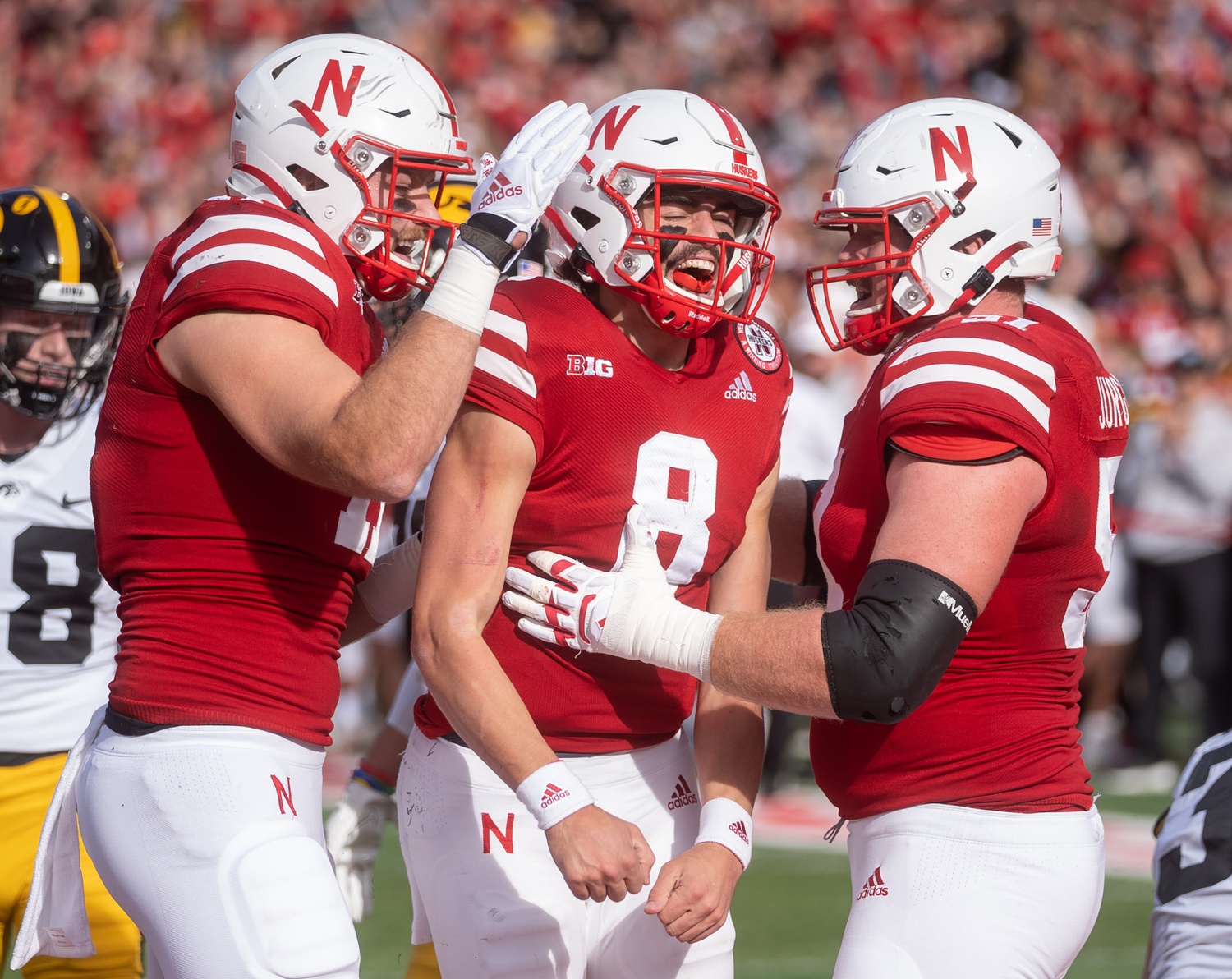 Nov 26, 2021; Lincoln, Nebraska, USA; Nebraska Cornhuskers quarterback Logan Smothers (8) celebrates after scoring against the Iowa Hawkeyes during the first quarter at Memorial Stadium.