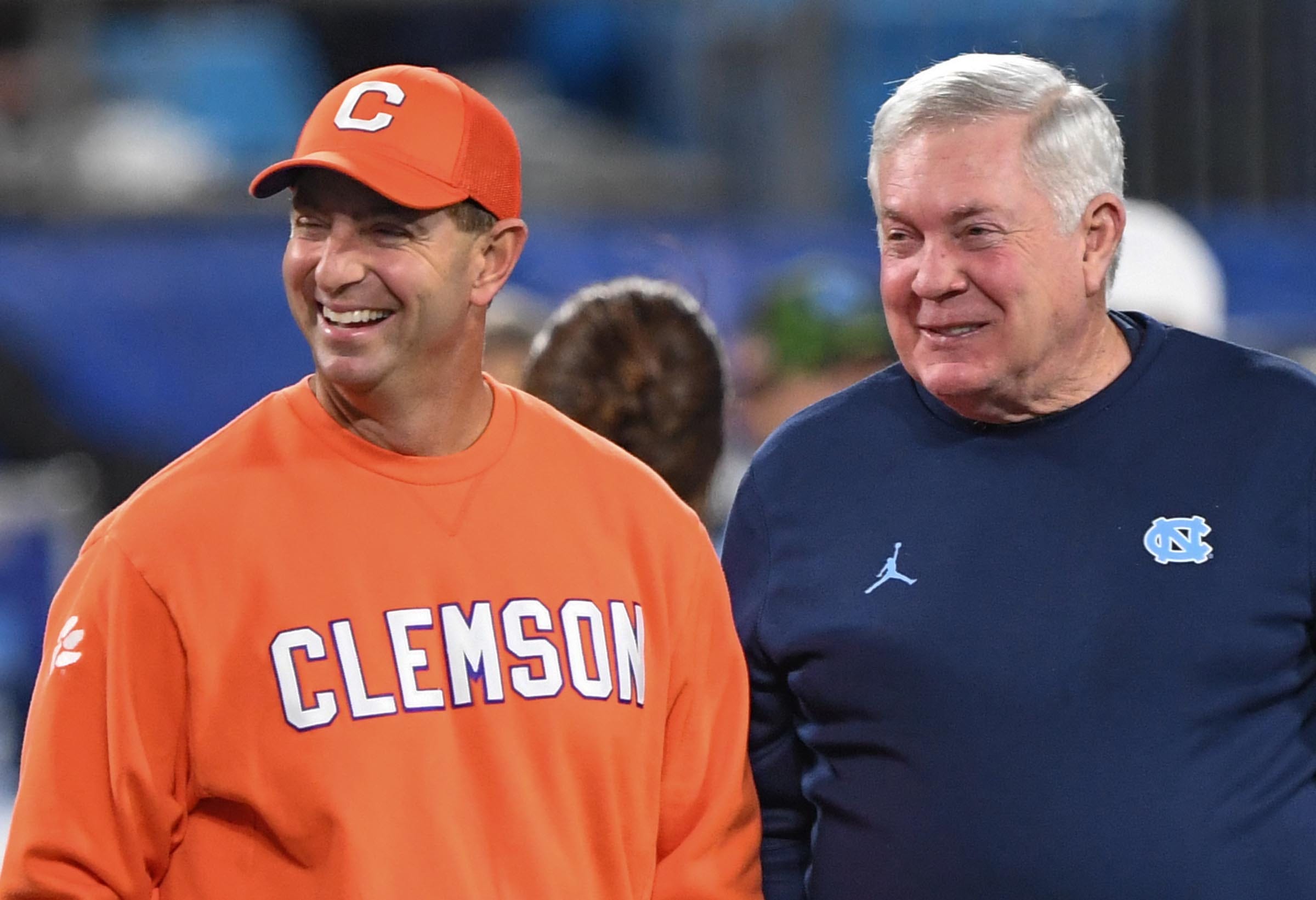Clemson head coach Dabo Swinney and North Carolina Coach Mack Brown talk before the ACC Championship football game with North Carolina at Bank of America Stadium in Charlotte