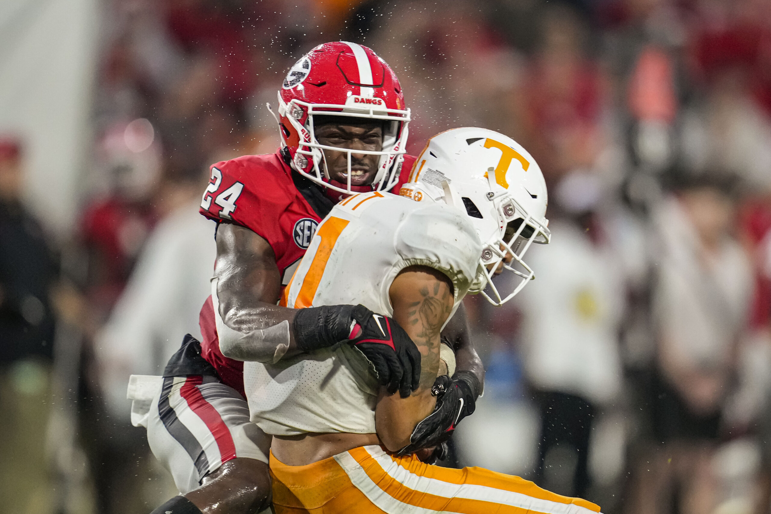 Nov 5, 2022; Athens, Georgia, USA; Georgia Bulldogs defensive back Malaki Starks (24) tackles Tennessee Volunteers wide receiver Jalin Hyatt (11) during the second half at Sanford Stadium.