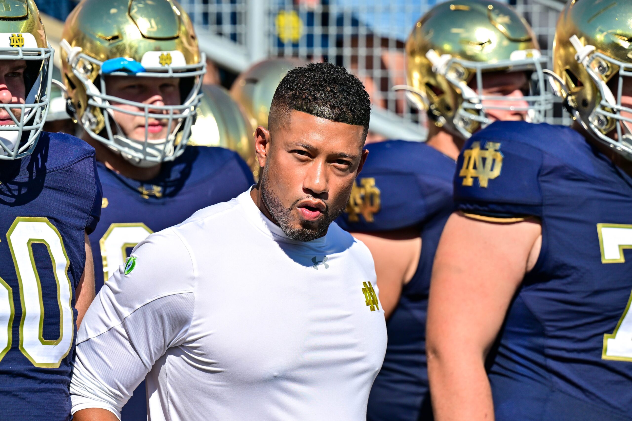 Sep 21, 2024; South Bend, Indiana, USA; Notre Dame Fighting Irish head coach Marcus Freeman prepares to lead his players onto the field for the game against the Miami Redhawks at Notre Dame Stadium.