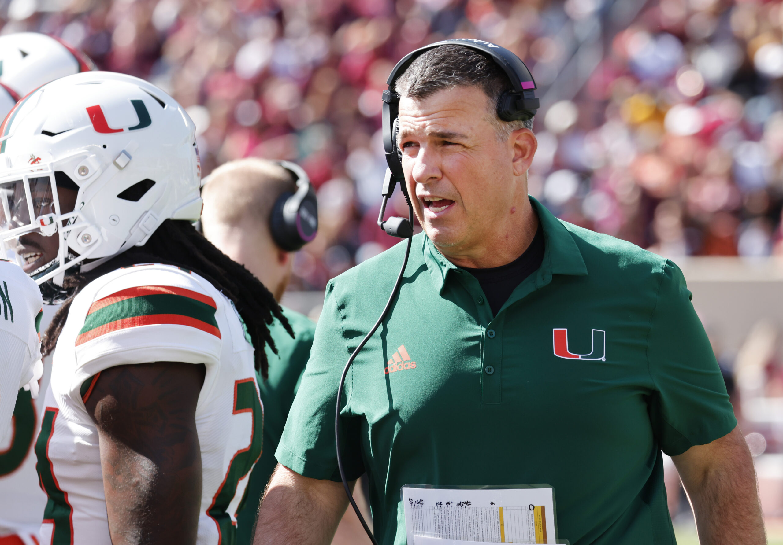 Oct 15, 2022; Blacksburg, Virginia, USA; Miami Hurricanes head coach Mario Cristobal walks on the sidelines during the second quarter against the Virginia Tech Hokies at Lane Stadium.