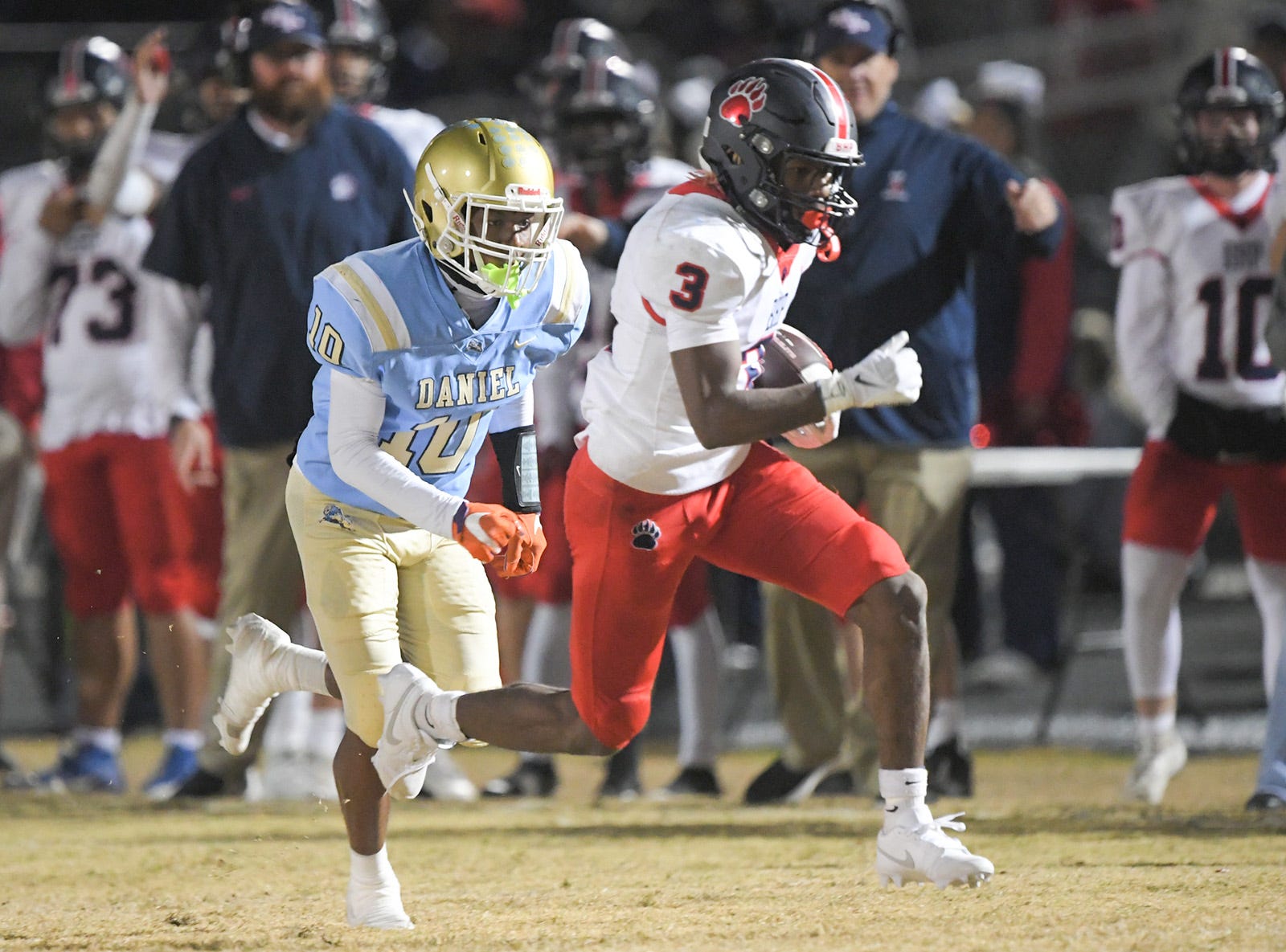 Belton-Honea Path junior Marquise Henderson (3) runs by DW Daniel junior Tremaine Davis, Jr. (10) for a touchdown during the second quarter of the Class 3A State Championship semifinal in Central, S.C. Friday, November 24, 2023.