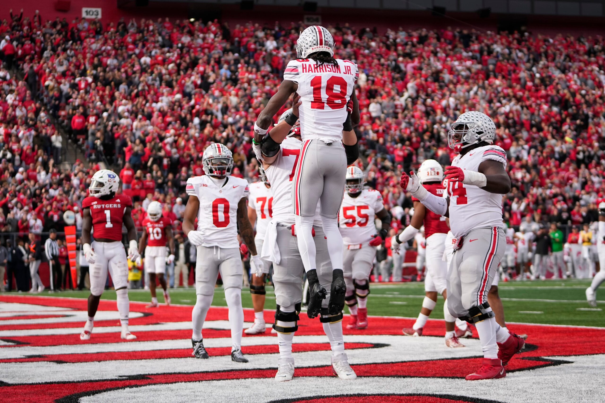 Dec 31, 2022; Atlanta, Georgia, USA; Ohio State Buckeyes wide receiver Marvin Harrison Jr. (18) reacts after scoring a touchdown against the Georgia Bulldogs during the second quarter of the 2022 Peach Bowl at Mercedes-Benz Stadium.