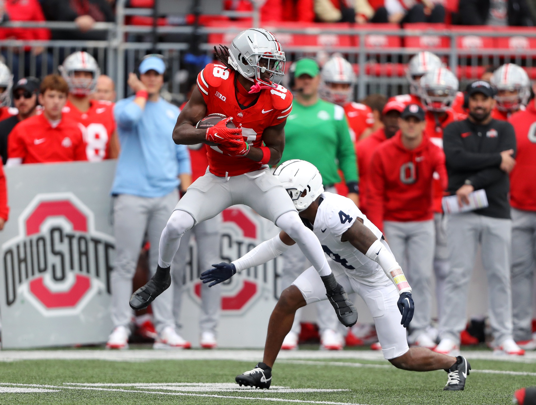 Oct 21, 2023; Columbus, Ohio, USA; Ohio State Buckeyes wide receiver Marvin Harrison Jr. (18) catches the football against Penn State Nittany Lions cornerback Kalen King (4) during the third quarter at Ohio Stadium.
