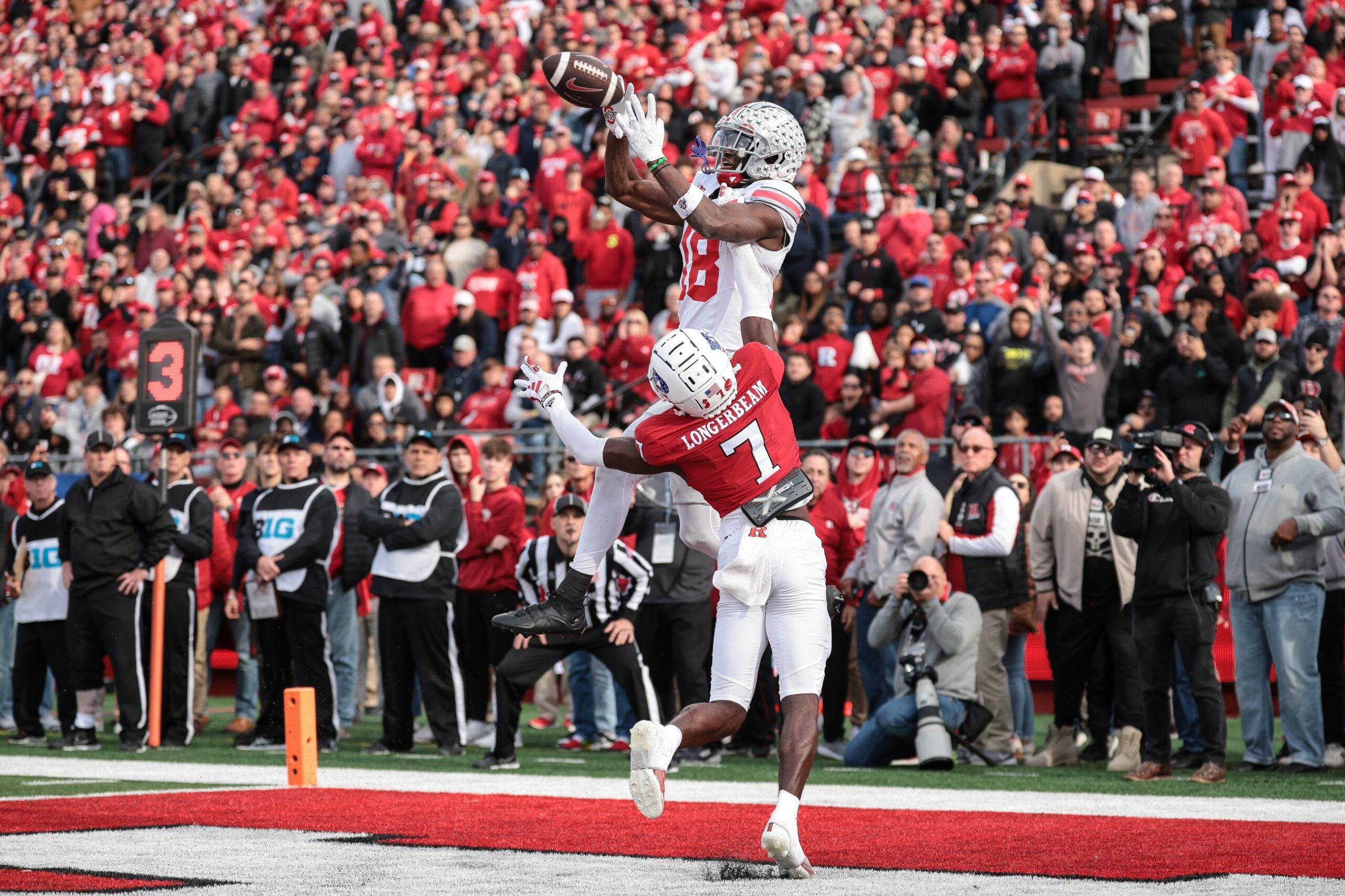 Nov 4, 2023; Piscataway, New Jersey, USA; Ohio State Buckeyes wide receiver Marvin Harrison Jr. (18) catches a touchdown pass against Rutgers Scarlet Knights defensive back Robert Longerbeam (7) during the second half at SHI Stadium.