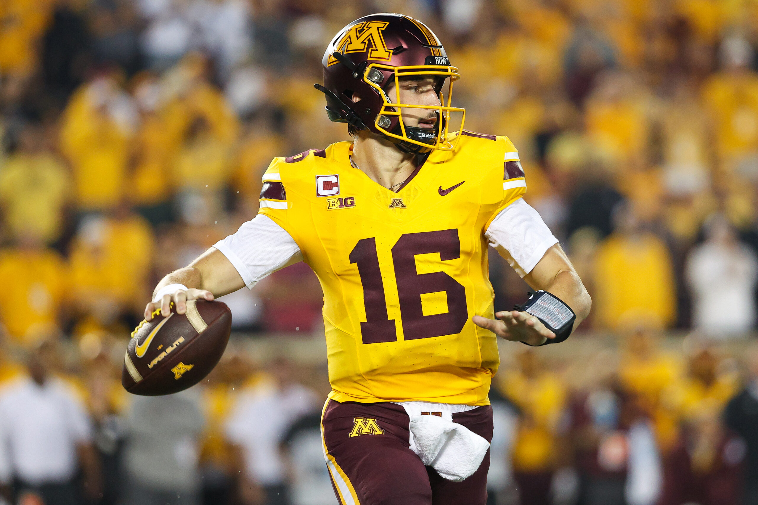 Aug 29, 2024; Minneapolis, Minnesota, USA; Minnesota Golden Gophers quarterback Max Brosmer (16) throws the ball against the North Carolina Tar Heels during the first half at Huntington Bank Stadium.