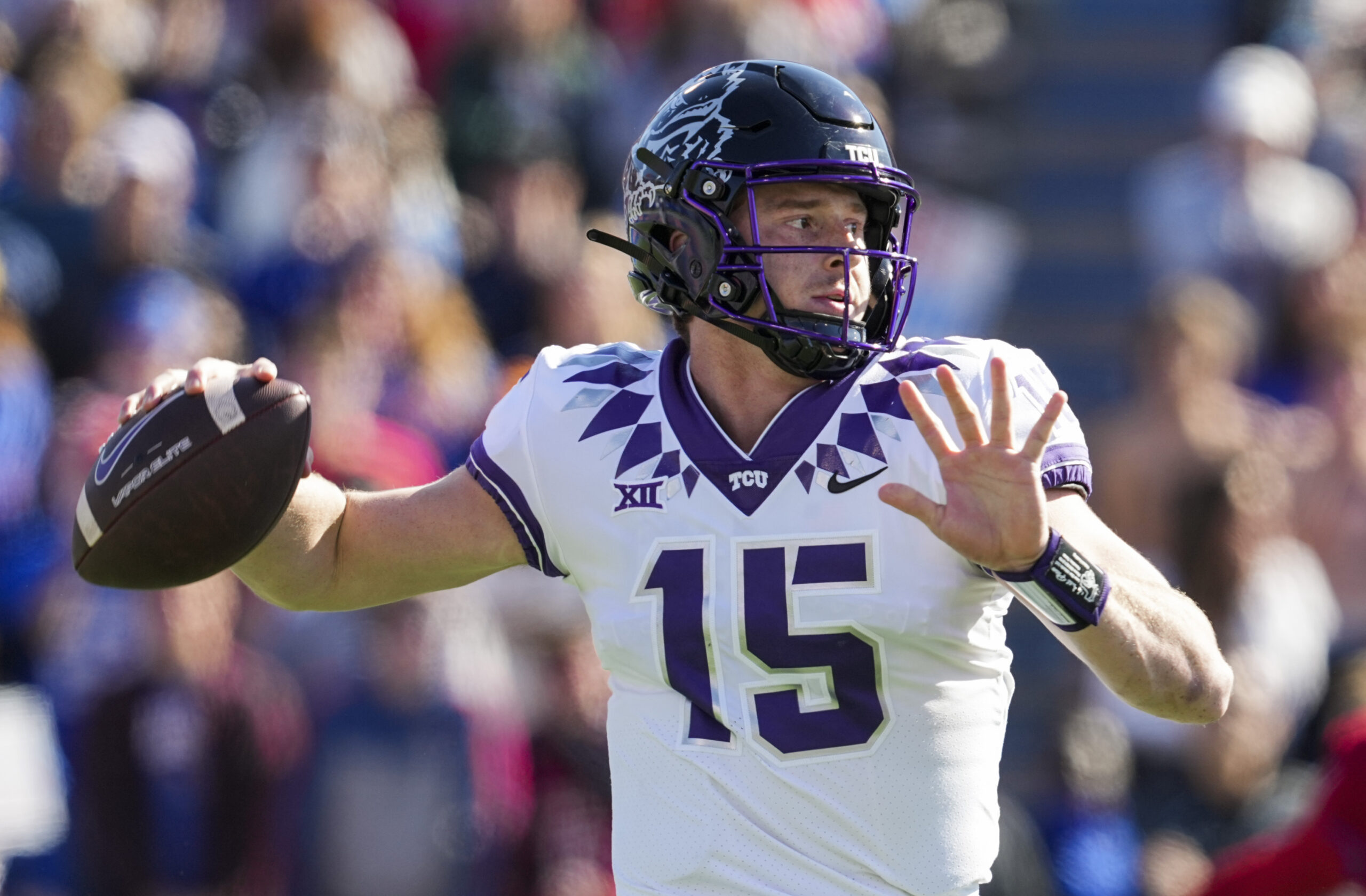 Oct 8, 2022; Lawrence, Kansas, USA; TCU Horned Frogs quarterback Max Duggan (15) throws a pass during the first half against the Kansas Jayhawks at David Booth Kansas Memorial Stadium.