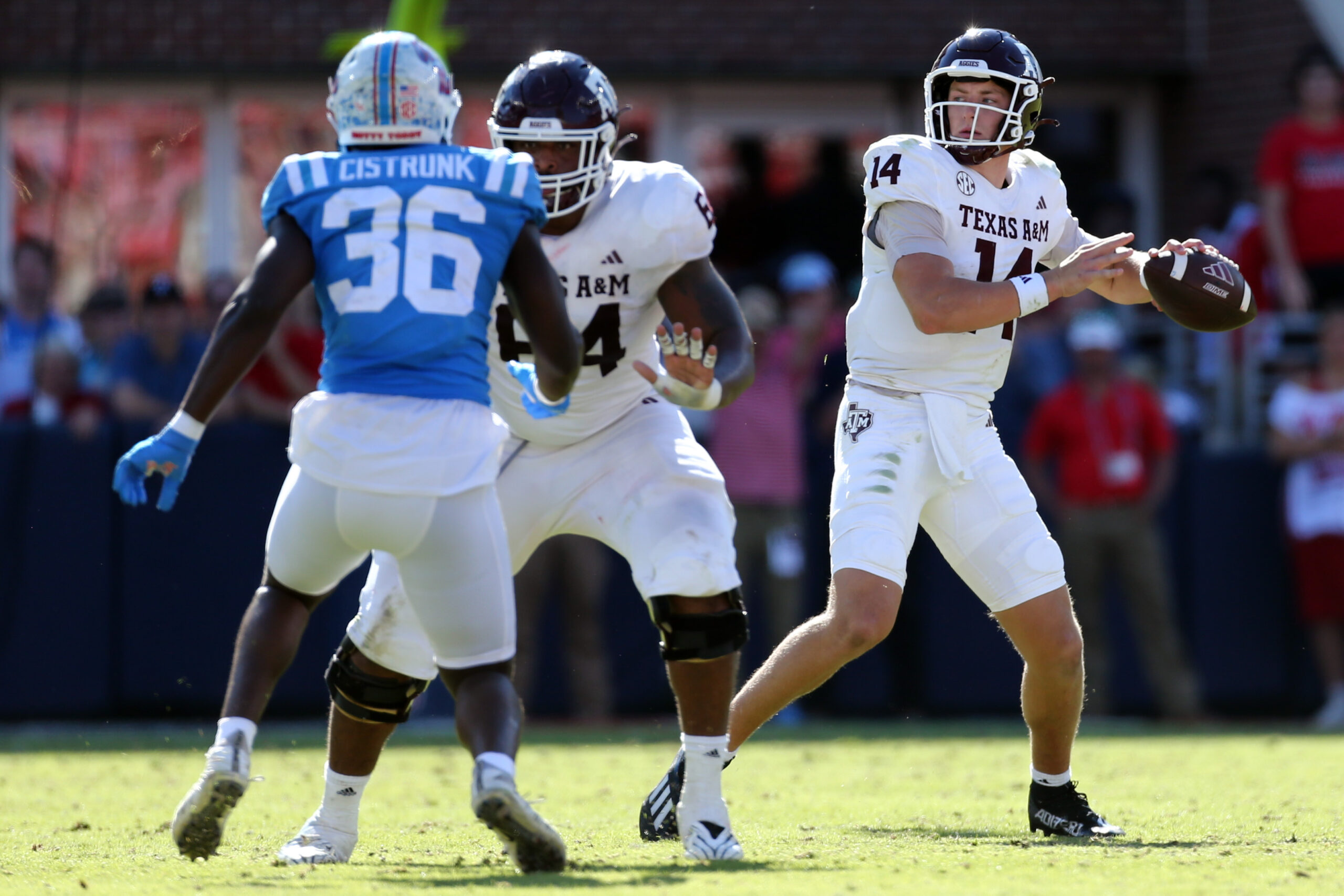 Nov 4, 2023; Oxford, Mississippi, USA; Texas A&M Aggies quarterback Max Johnson (14) passes the ball against the Mississippi Rebels during the second half at Vaught-Hemingway Stadium. 