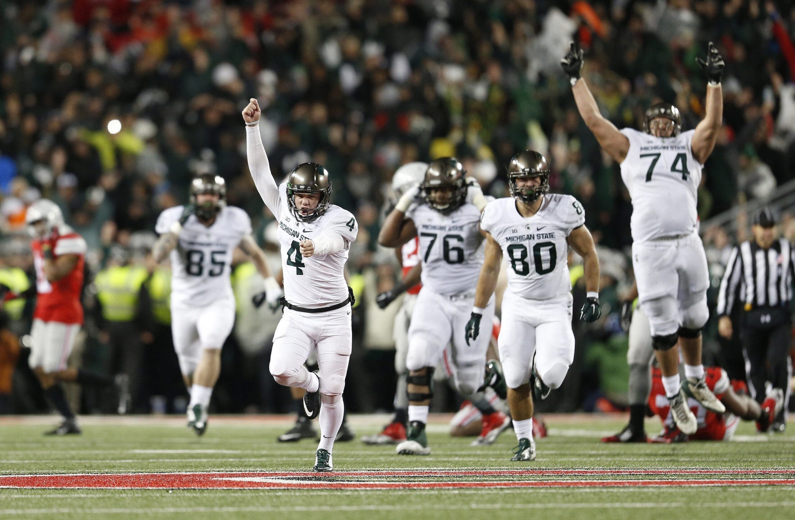 Michigan State kicker Michael Geiger (4) celebrates a 41-yard field goal as time expired in the fourth quarter to stun Ohio State, 17-14, on Saturday, Nov. 21, 2015, at Ohio Stadium in Columbus, Ohio.