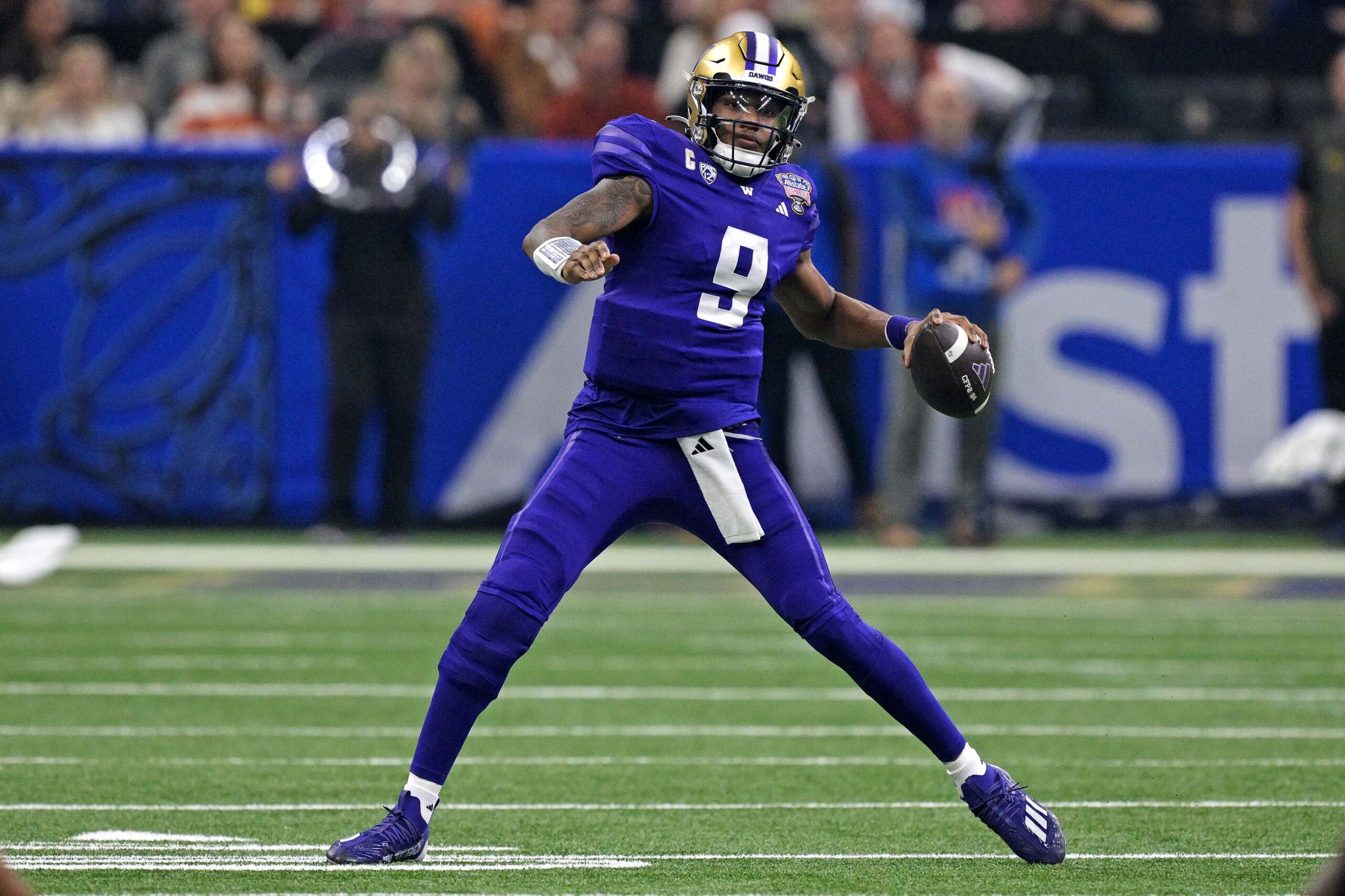 Jan 1, 2024; New Orleans, LA, USA; Washington Huskies quarterback Michael Penix Jr. (9) throws a pass during the second quarter against the Texas Longhorns in the 2024 Sugar Bowl college football playoff semifinal game at Caesars Superdome.