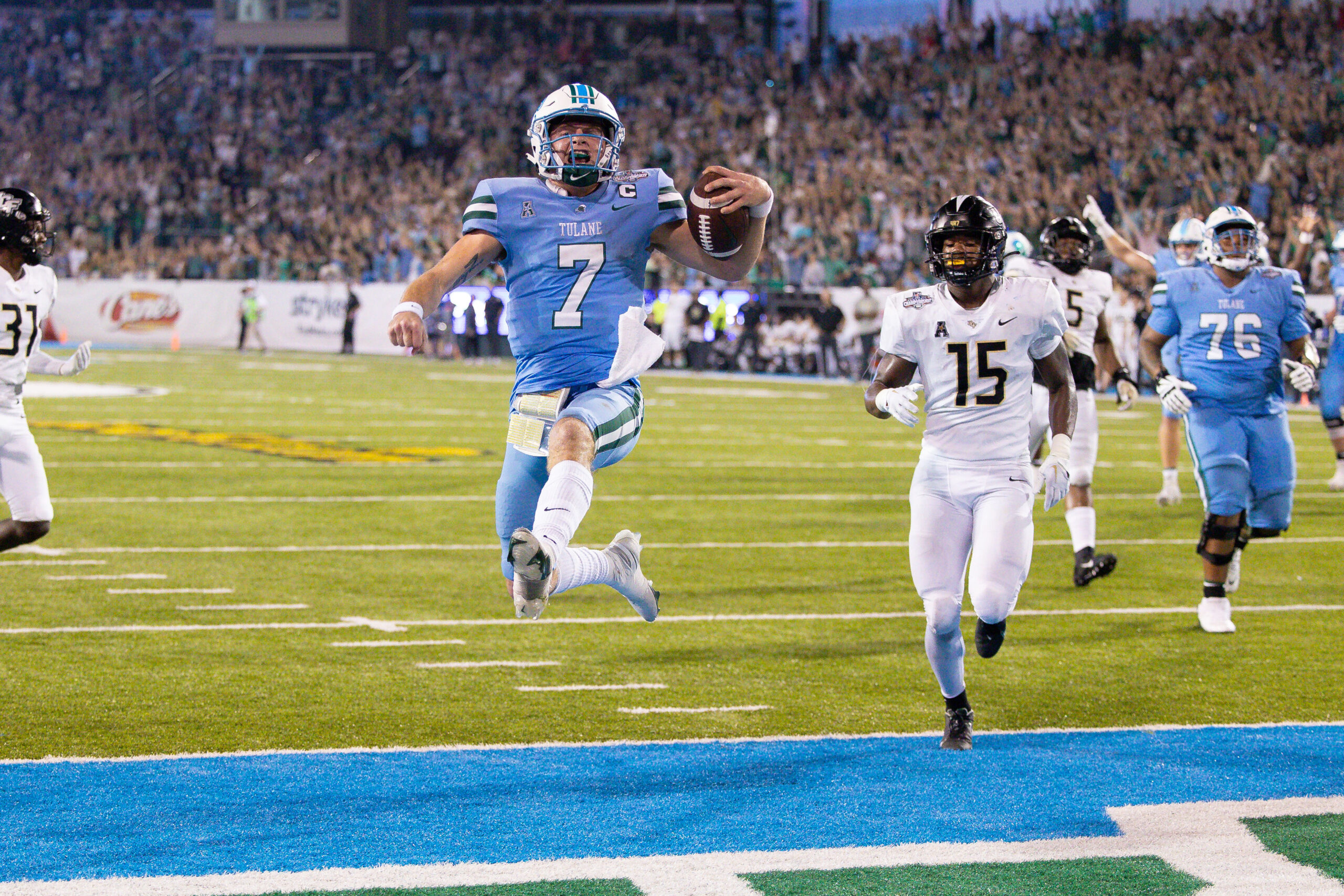 Dec 3, 2022; New Orleans, Louisiana, USA; Tulane Green Wave quarterback Michael Pratt (7) rushes in for a touchdown against the UCF Knights during the second half at Yulman Stadium.