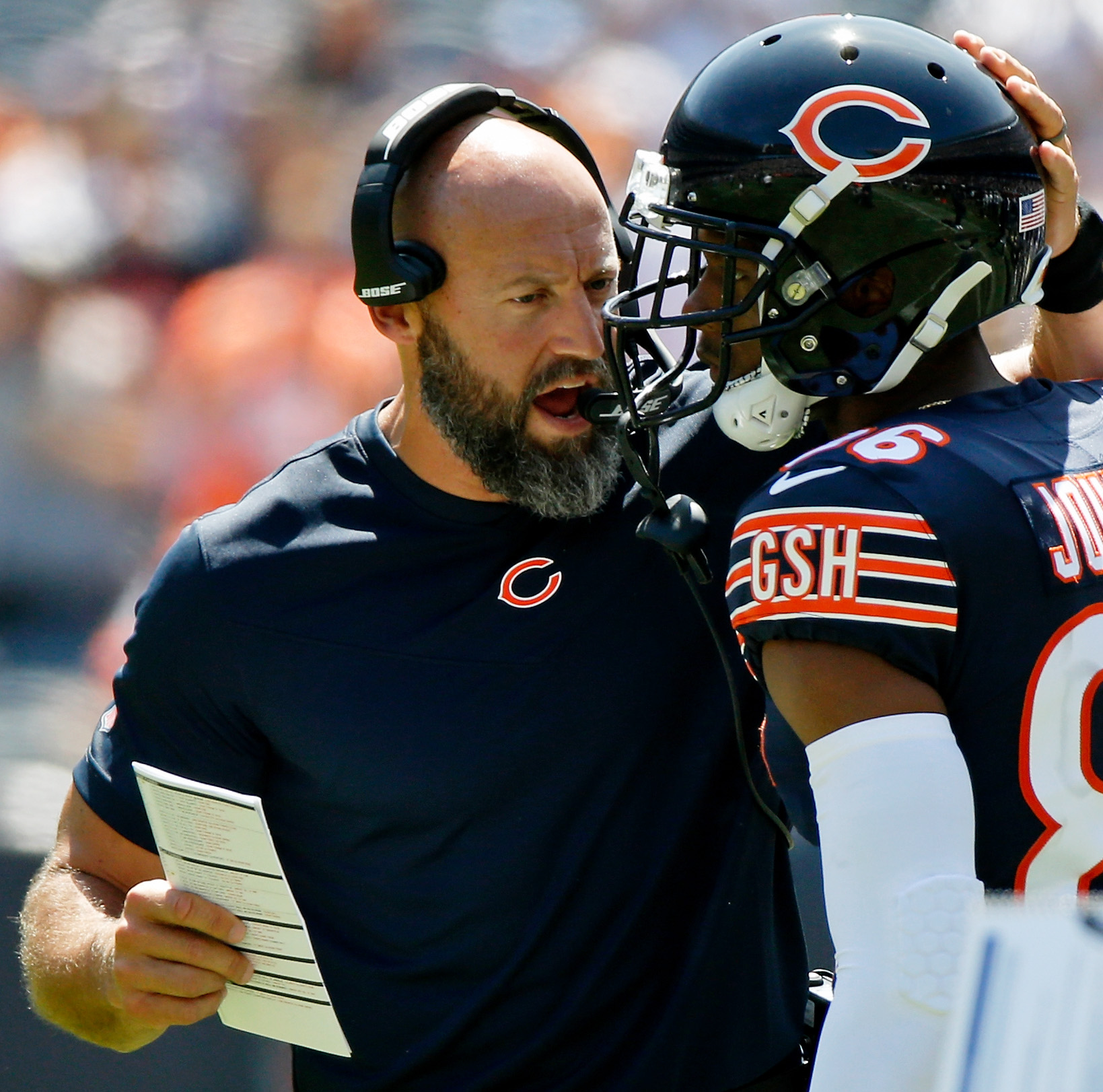 Aug 14, 2021; Chicago, Illinois, USA; Chicago Bears wide receivers coach Mike Furrey instructs wide receiver Jon'Vea Johnson (86) on the sidelines against the Miami Dolphins during the first half at Soldier Field.