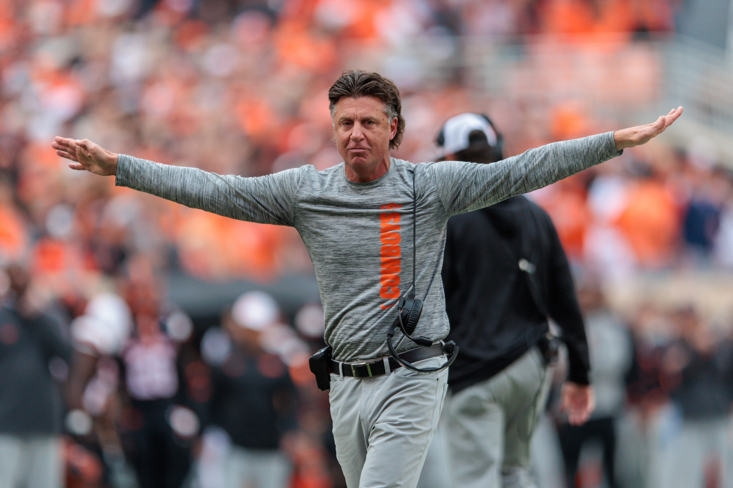 Nov 2, 2024; Stillwater, Oklahoma, USA; Oklahoma State Cowboys coach Mike Gundy reacts after a call during the second quarter against the Arizona State Sun Devils at Boone Pickens Stadium. 