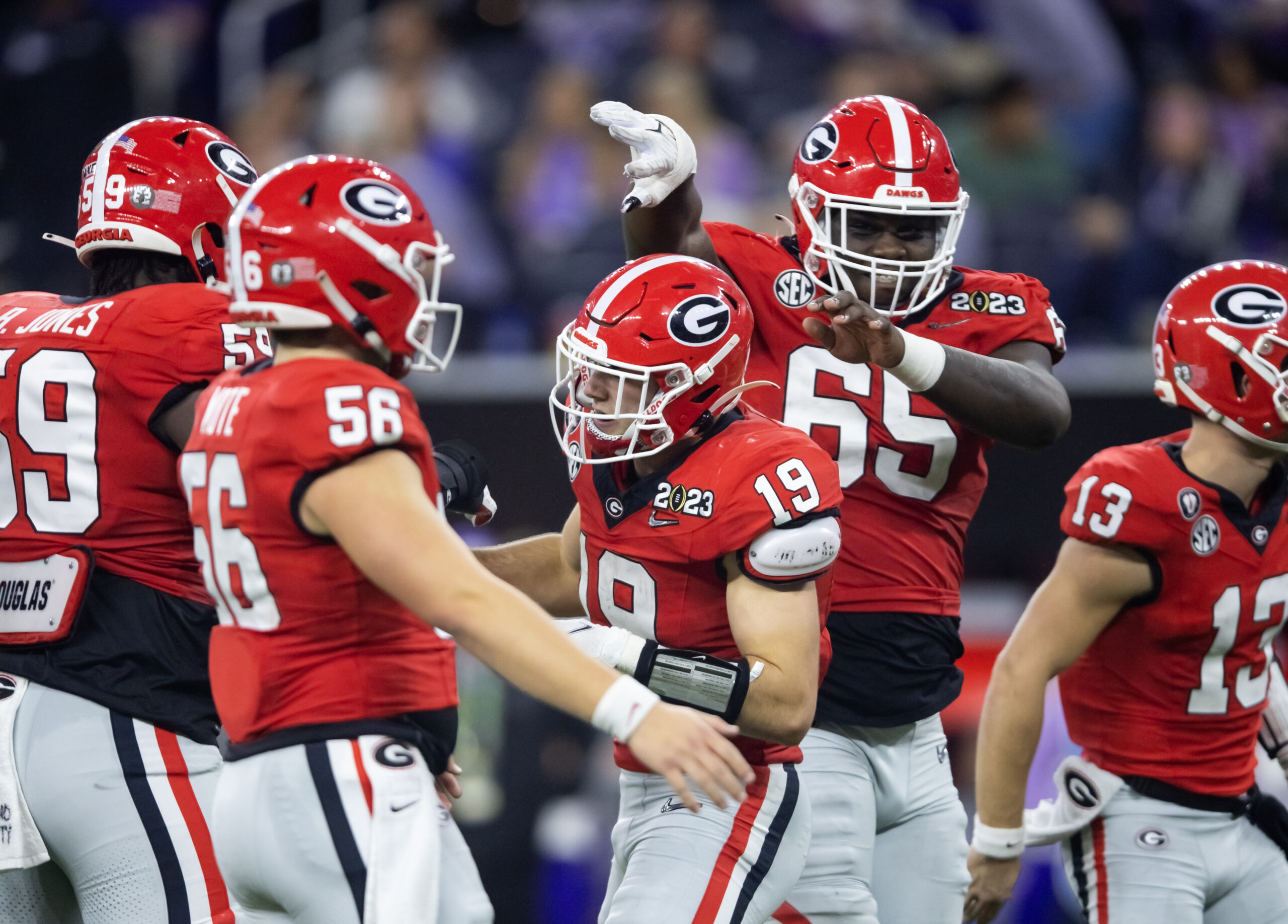 Jan 9, 2023; Inglewood, CA, USA; Georgia Bulldogs tight end Brock Bowers (19) celebrates a touchdown with offensive lineman Amarius Mims (65) against the TCU Horned Frogs during the CFP national championship game at SoFi Stadium. Mandatory Credit: Mark J. Rebilas-USA TODAY Sports