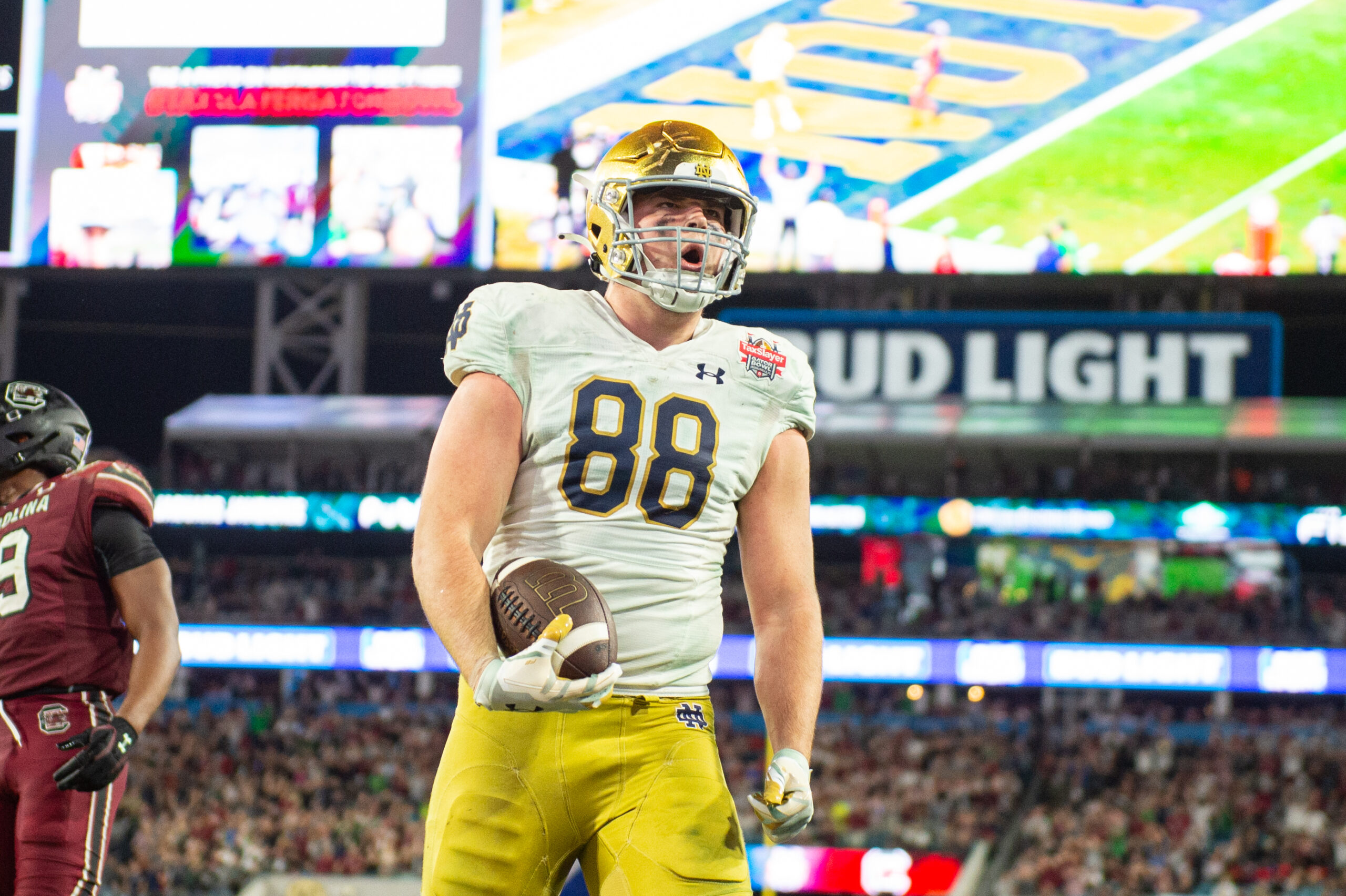 Dec 30, 2022; Jacksonville, FL, USA;Notre Dame Fighting Irish tight end Mitchell Evans (88) celebrates his touchdown against the South Carolina Gamecocks in the fourth quarter in the 2022 Gator Bowl at TIAA Bank Field.