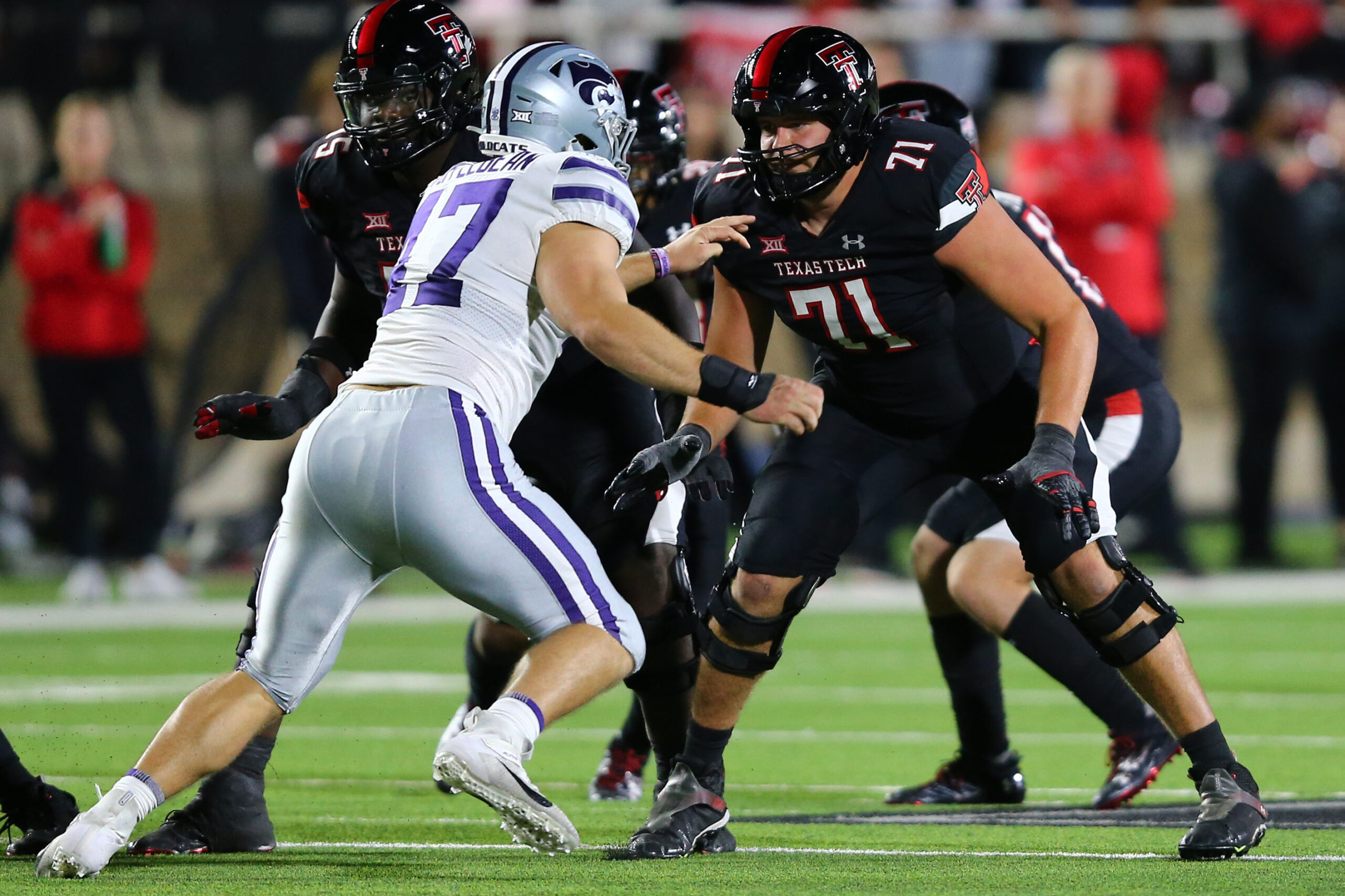 Oct 14, 2023; Lubbock, Texas, USA; Texas Tech Red Raiders offensive tackle Monroe Mills (71) prepares to block Kansas State Wildcats defensive end Cody Stufflebean (47) in the second half at Jones AT&T Stadium and Cody Campbell Field.