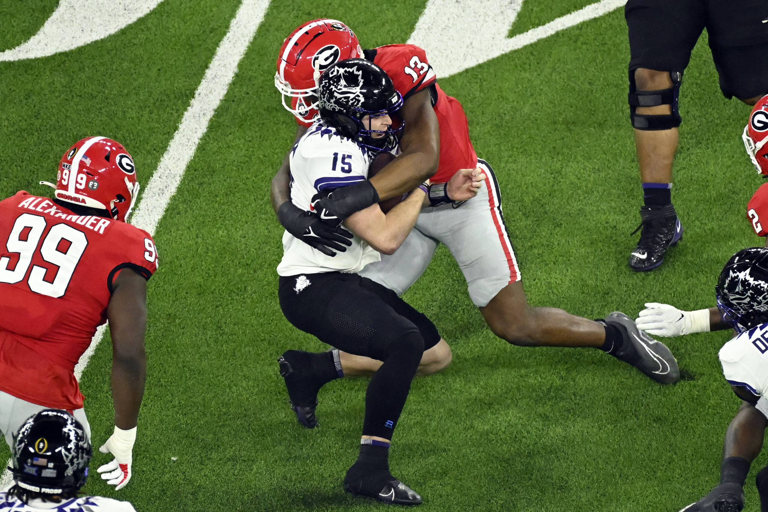 Sep 16, 2023; Athens, Georgia, USA; Georgia Bulldogs defensive lineman Mykel Williams (13) tackles South Carolina Gamecocks quarterback Spencer Rattler (7) during the second half at Sanford Stadium.