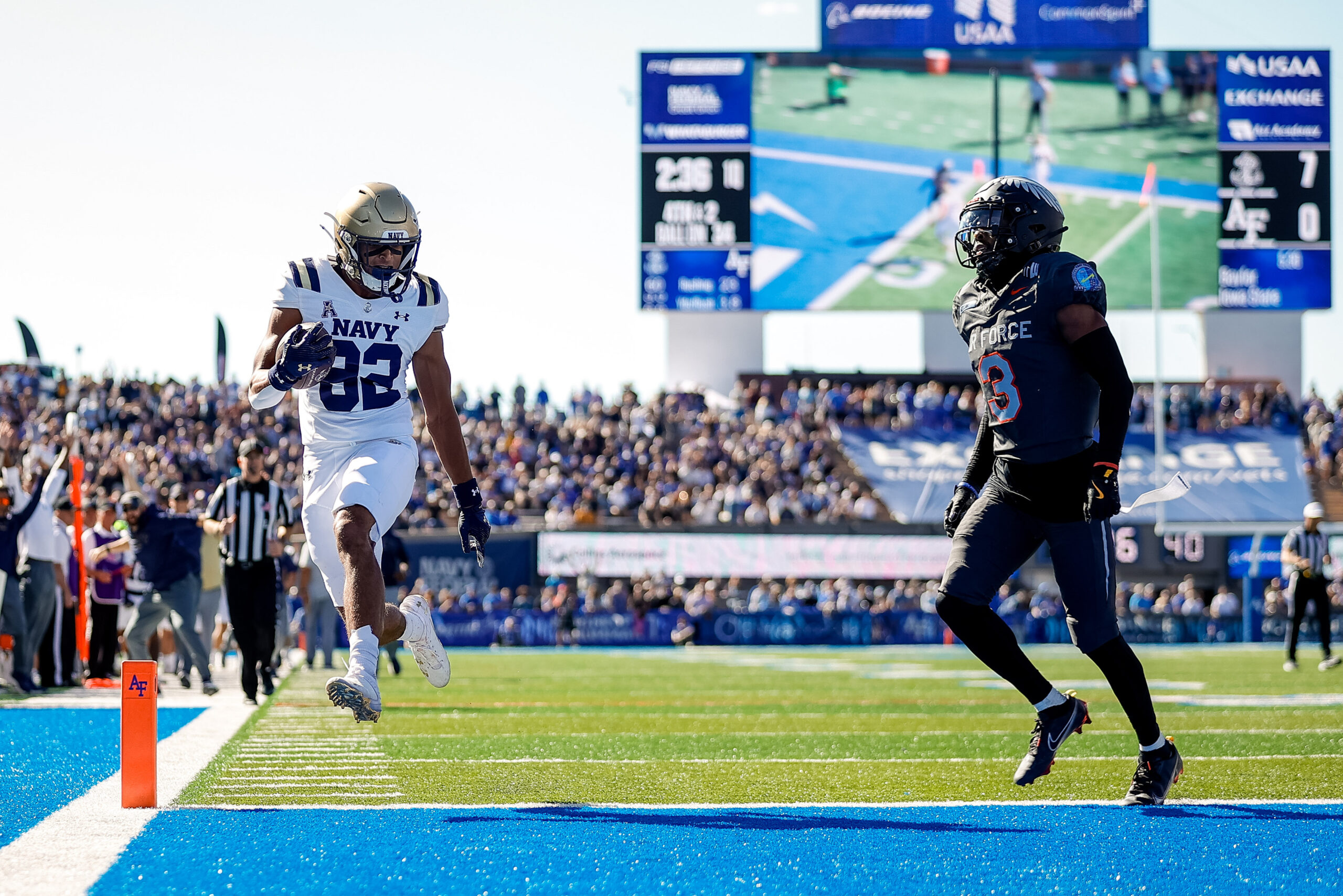 Oct 5, 2024; Colorado Springs, Colorado, USA; Navy Midshipmen wide receiver Nathan Kent (82) runs for a touchdown against Air Force Falcons cornerback Jamari Bellamy (3) in the first quarter at Falcon Stadium.